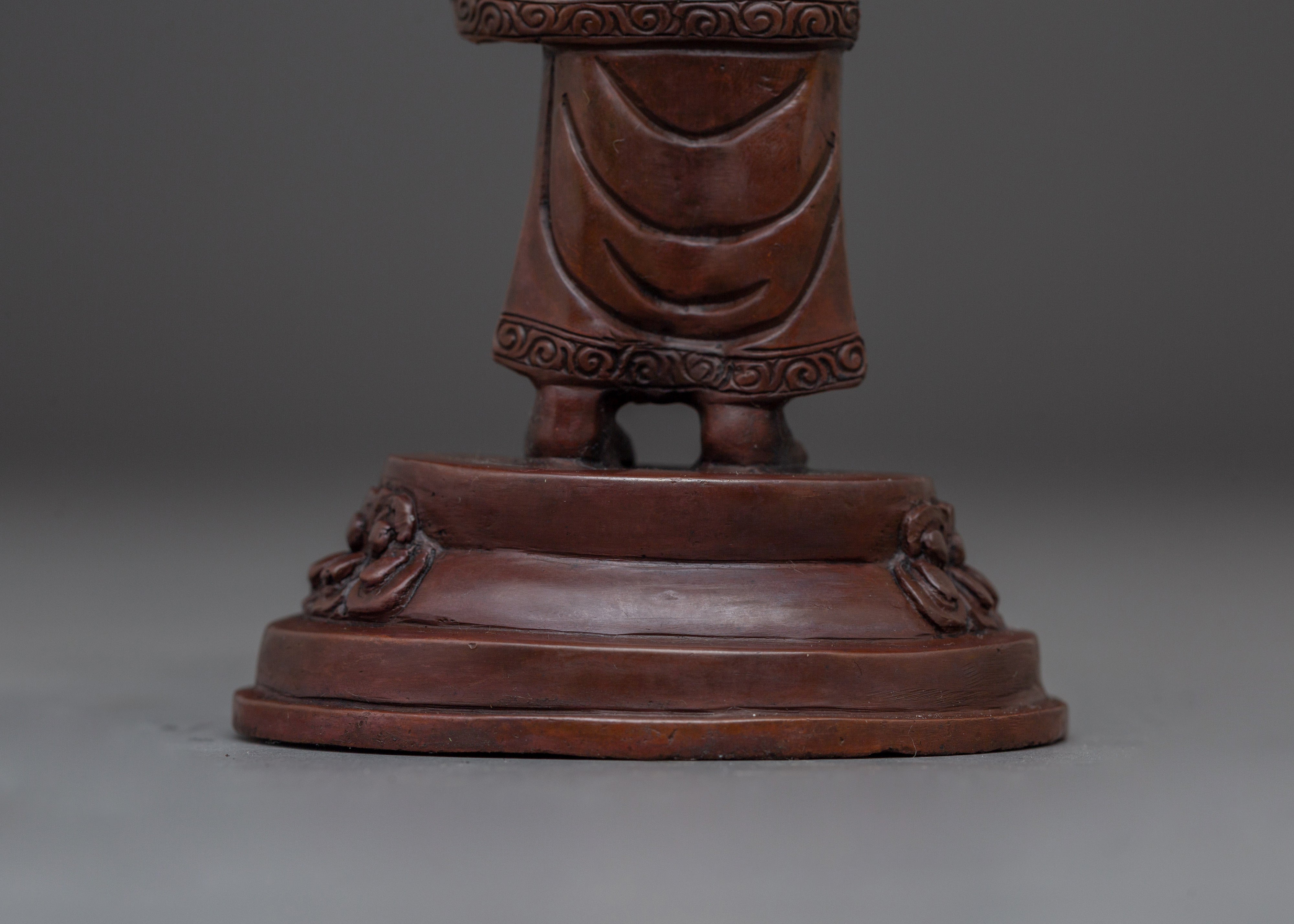 Standing Buddha Holding a Calf Statue | Unique Buddhist Statue