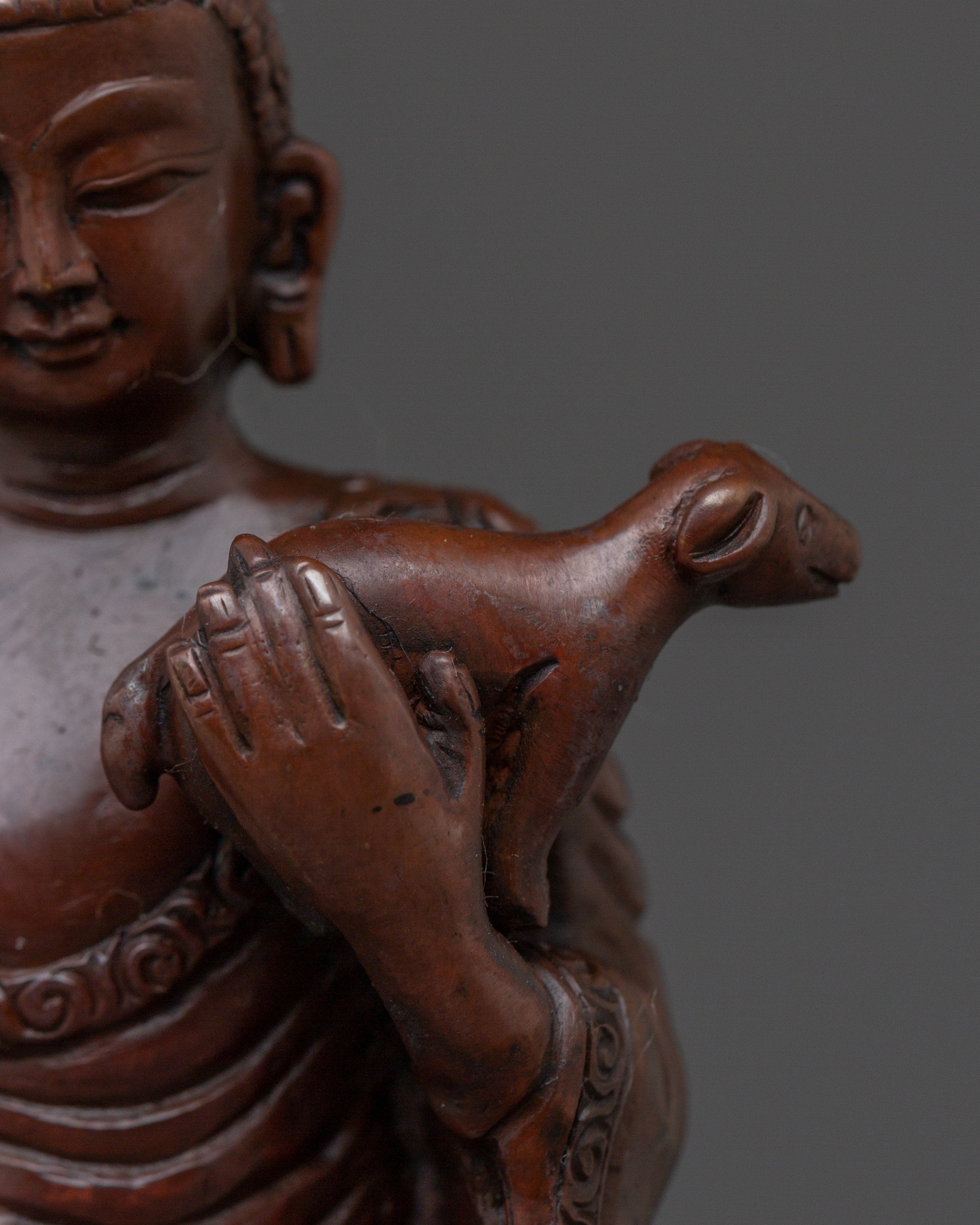 Standing Buddha Holding a Calf Statue | Unique Buddhist Statue