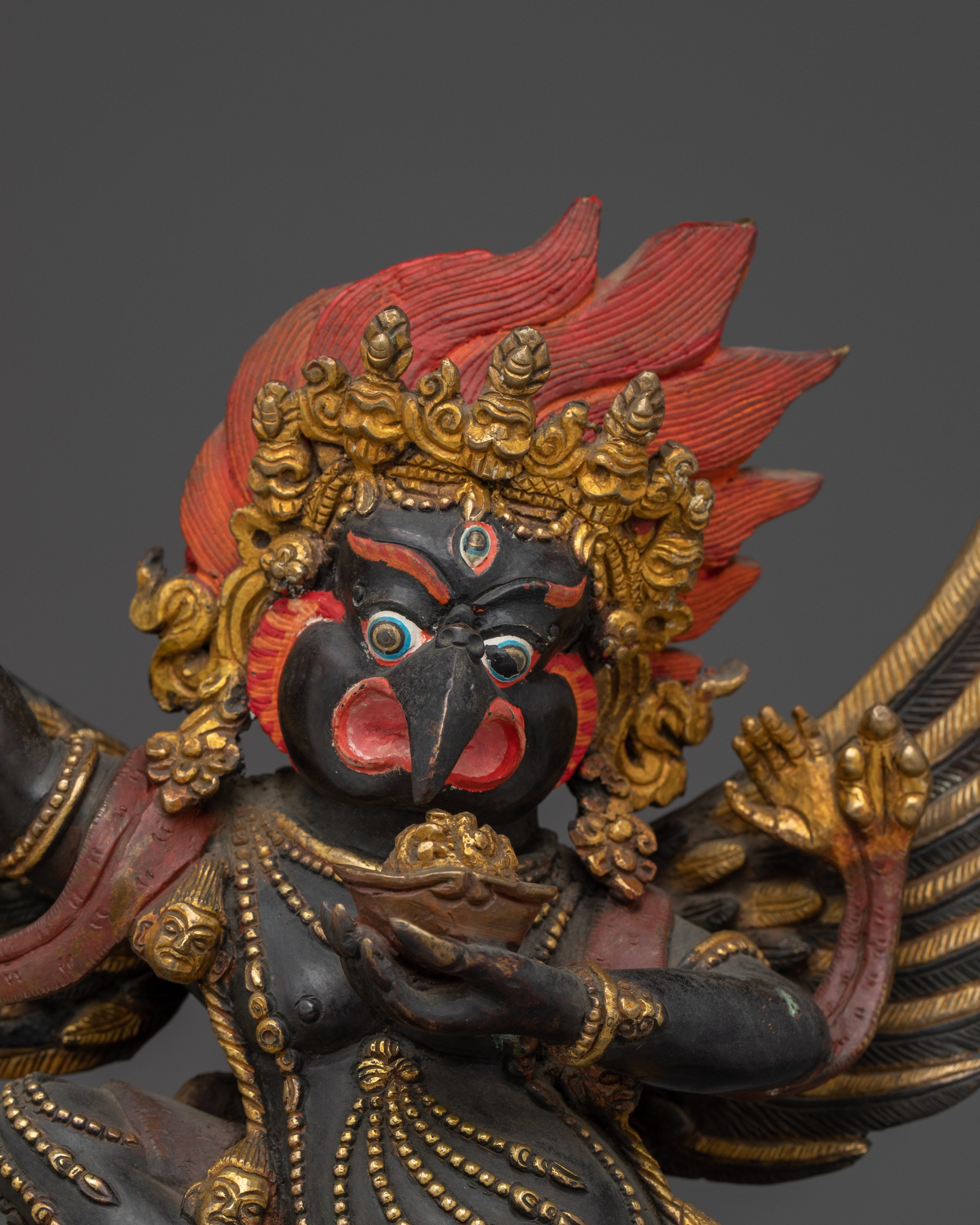 Mythical bird deity Garuda | Protector against Nagas