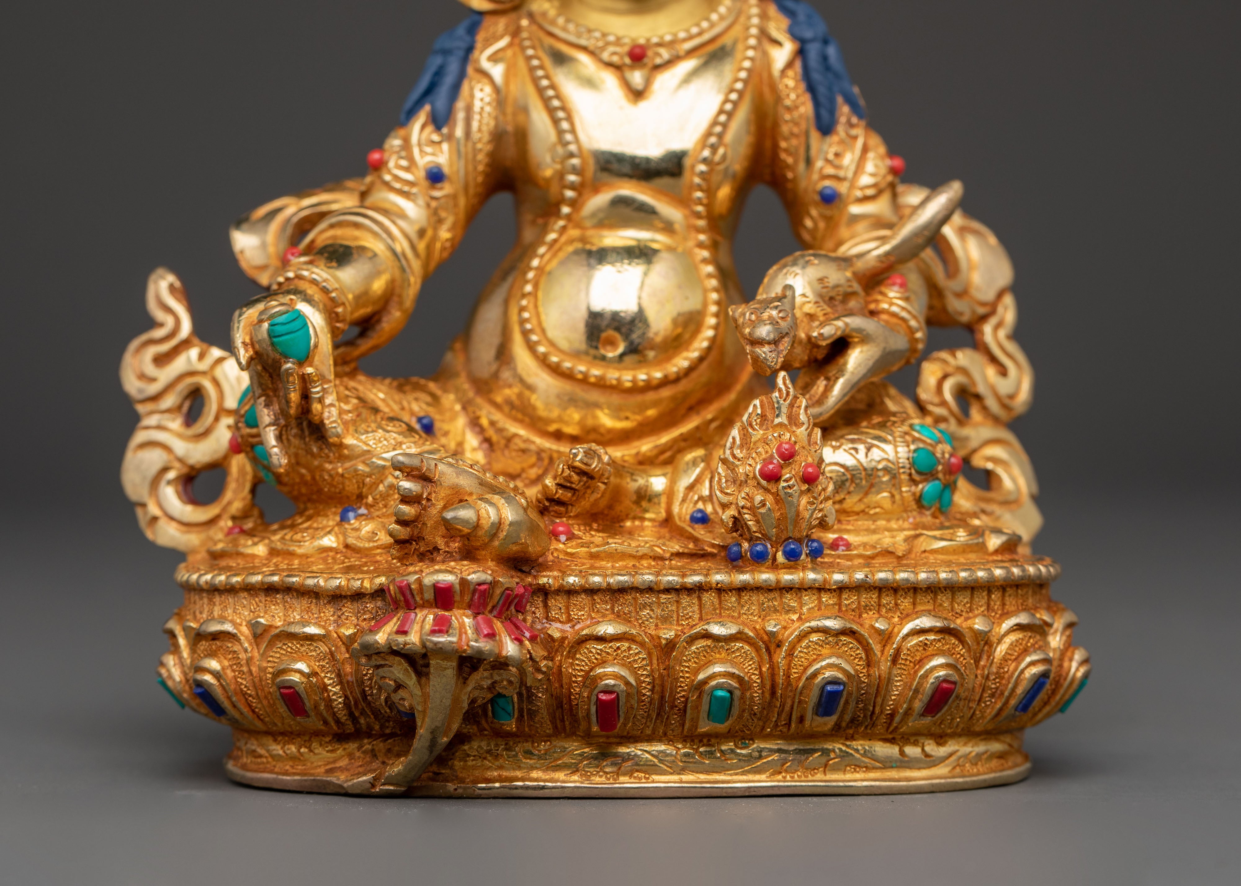 Statue of Dzambhala: Buddhist Wealth Icon