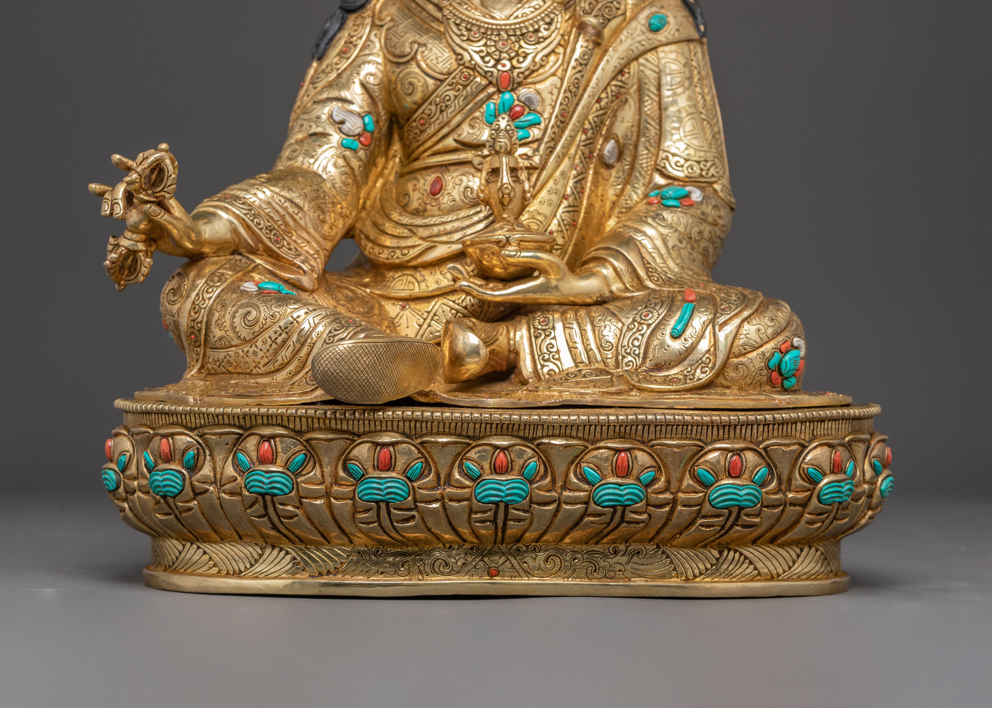 Statue of Guru Rinpoche with Yeshe Tshogyal and Mandharva