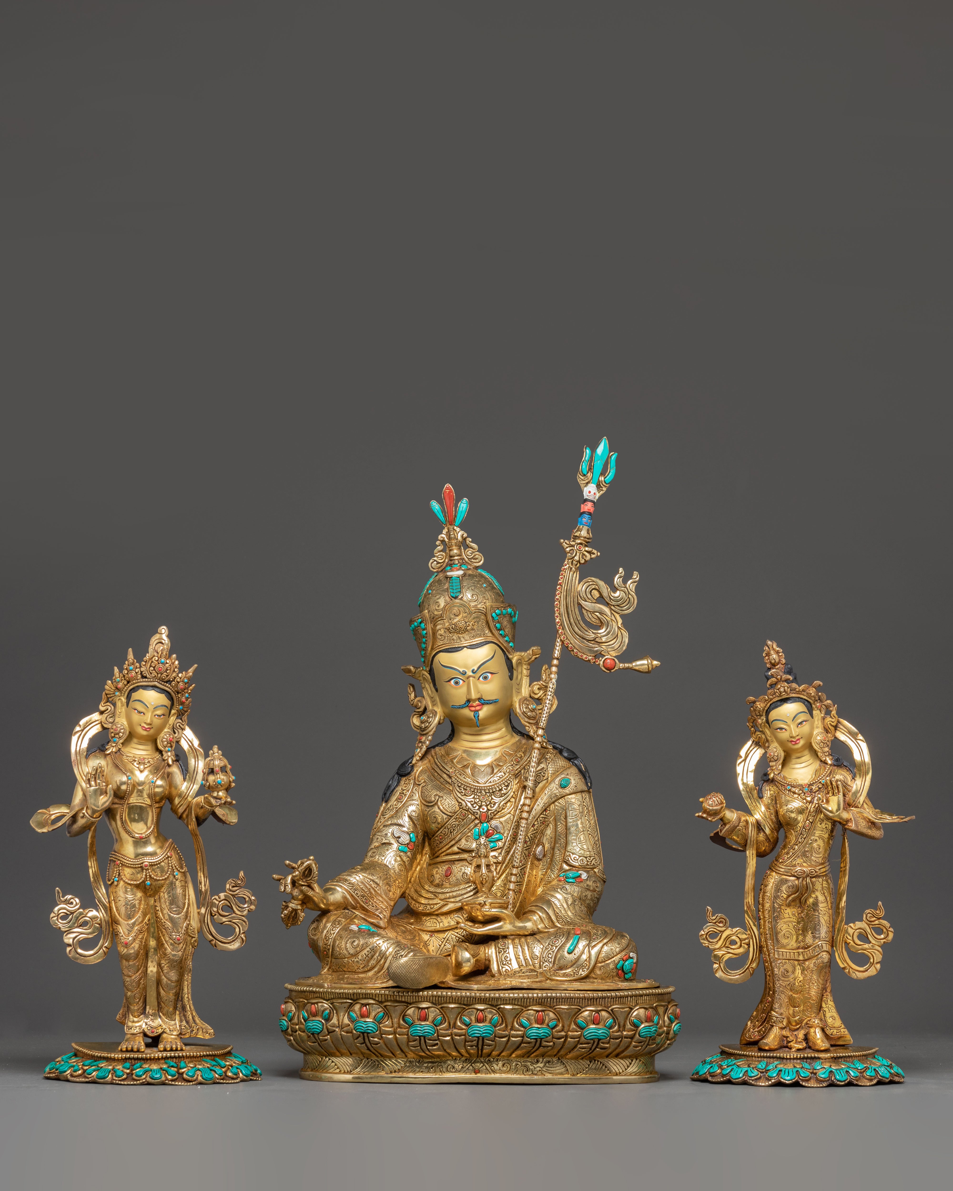 Statue of Guru Rinpoche with Yeshe Tshogyal and Mandharva