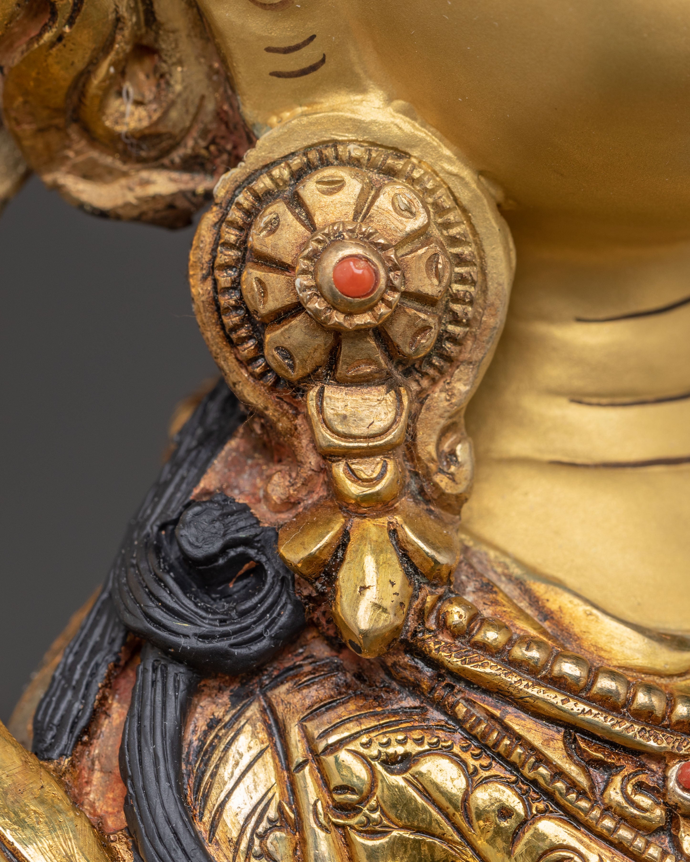 Statue of Guru Rinpoche with Yeshe Tshogyal and Mandharva