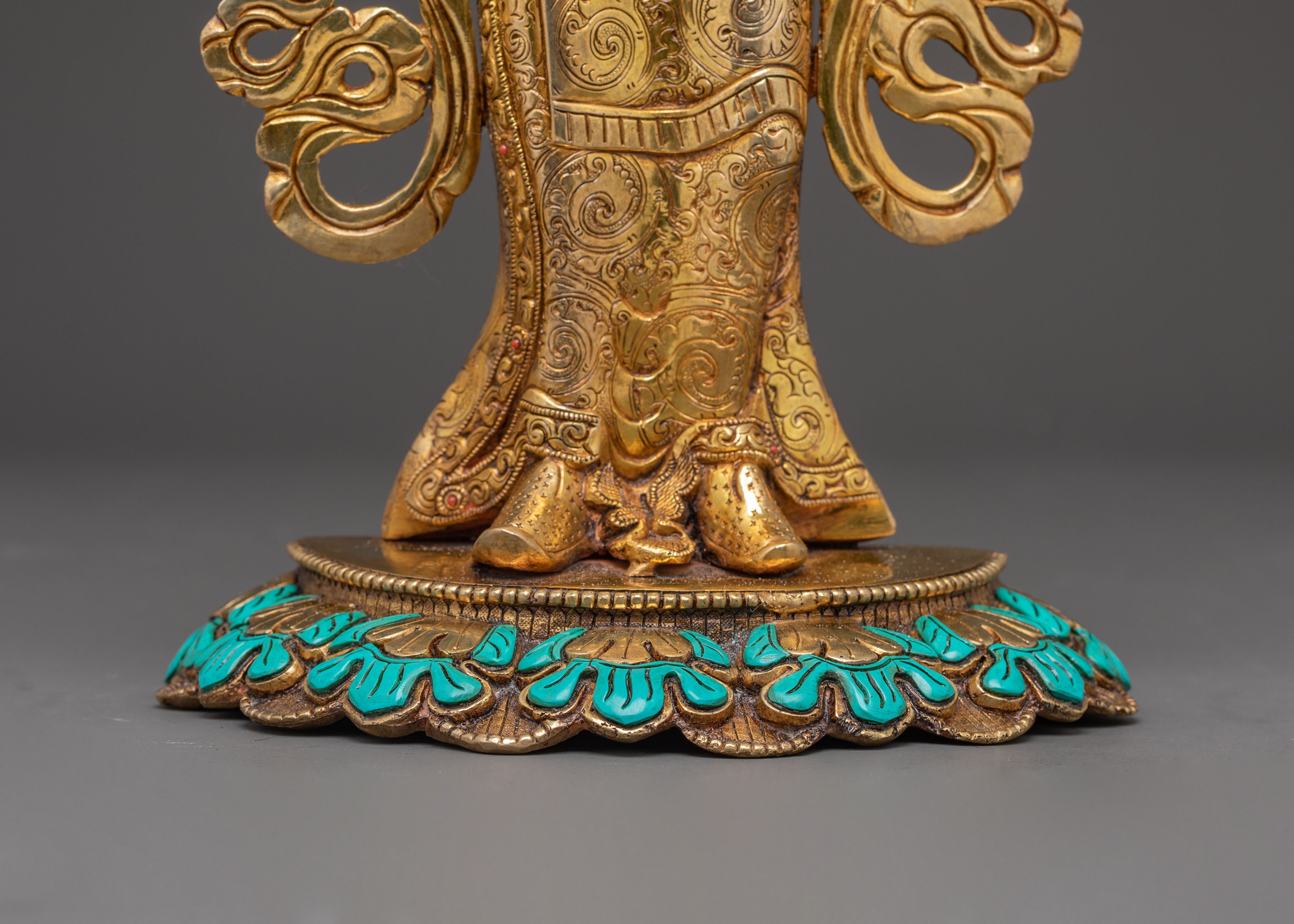 Statue of Guru Rinpoche with Yeshe Tshogyal and Mandharva