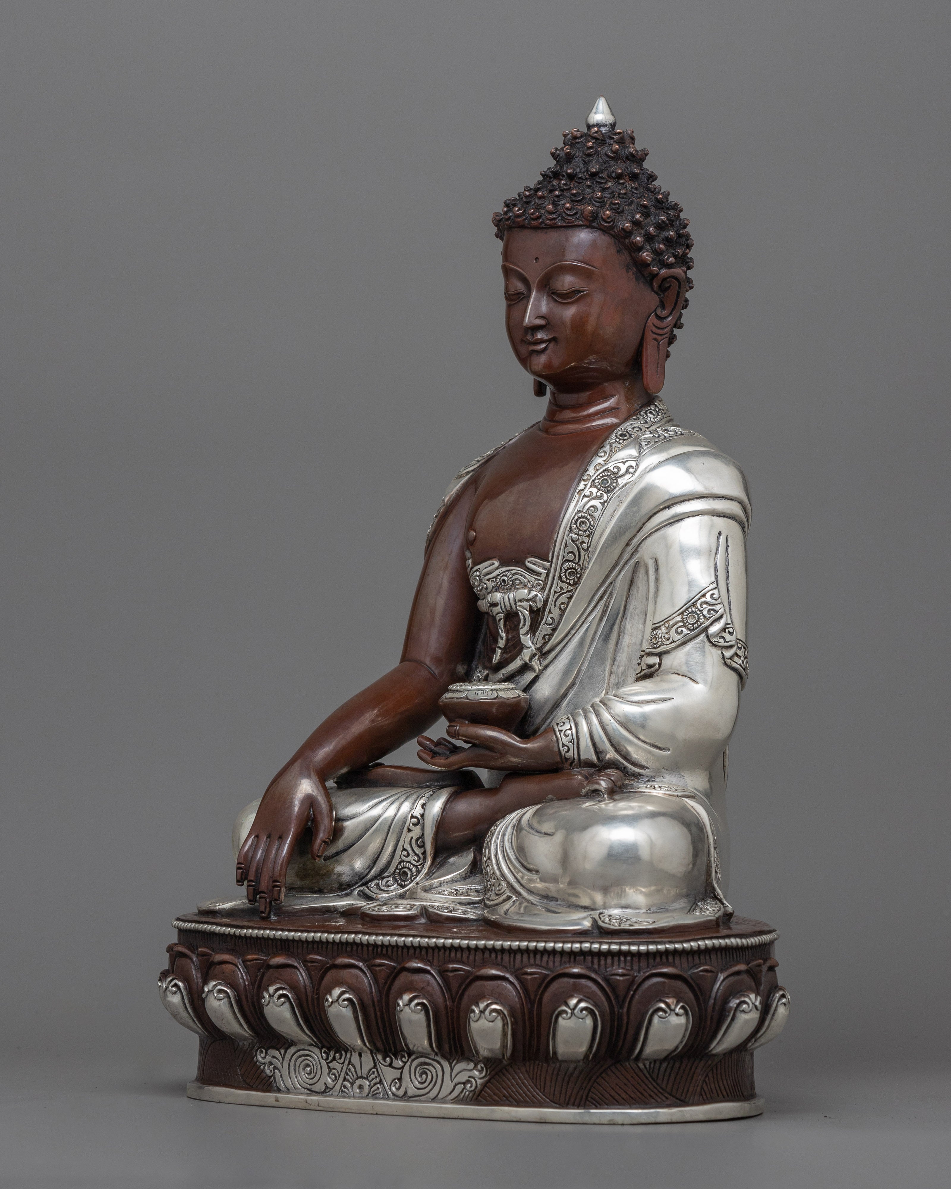 silver plated buddha statue