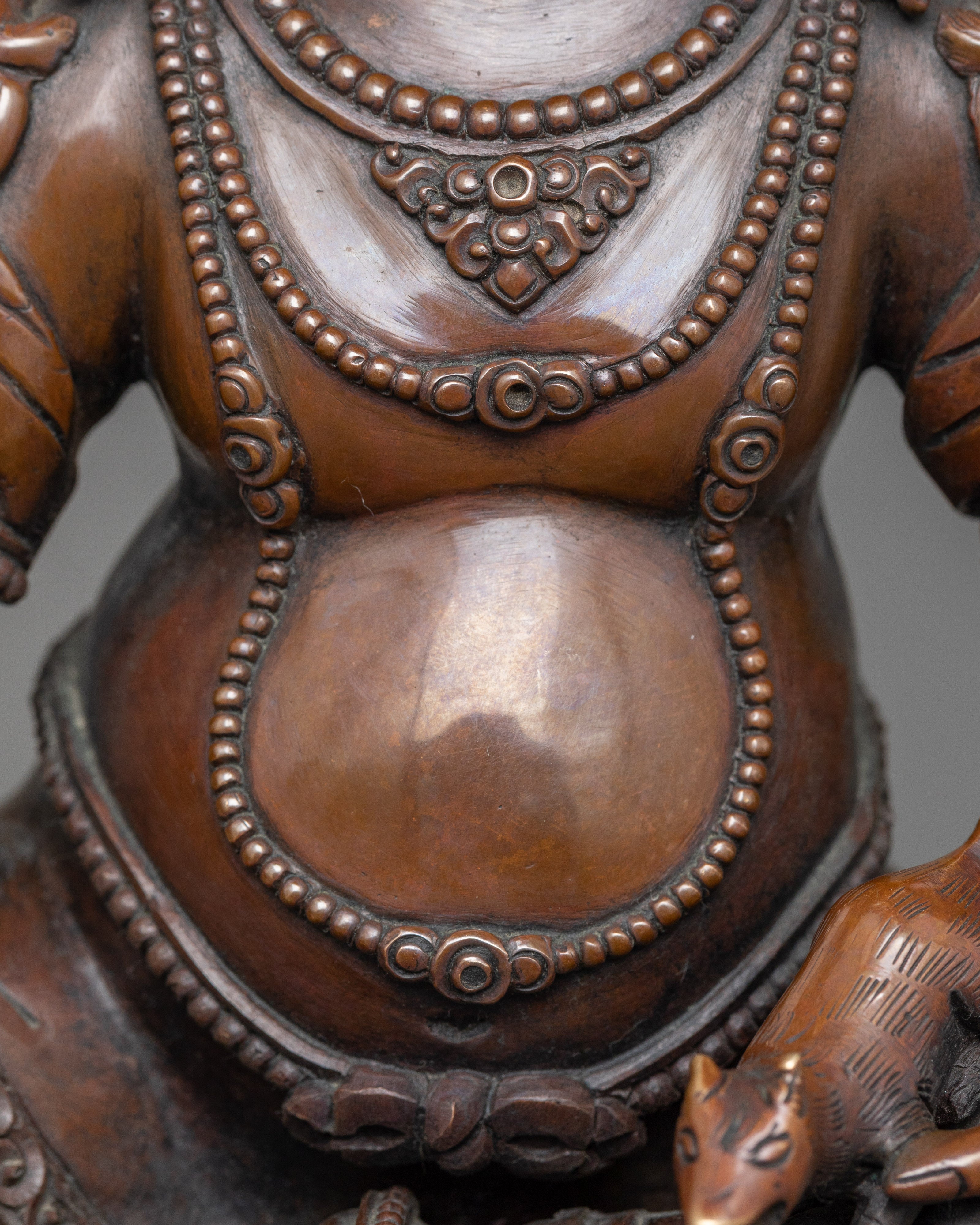 Yellow Zambhala Statue | An Oxidized Copper Emblem of Prosperity