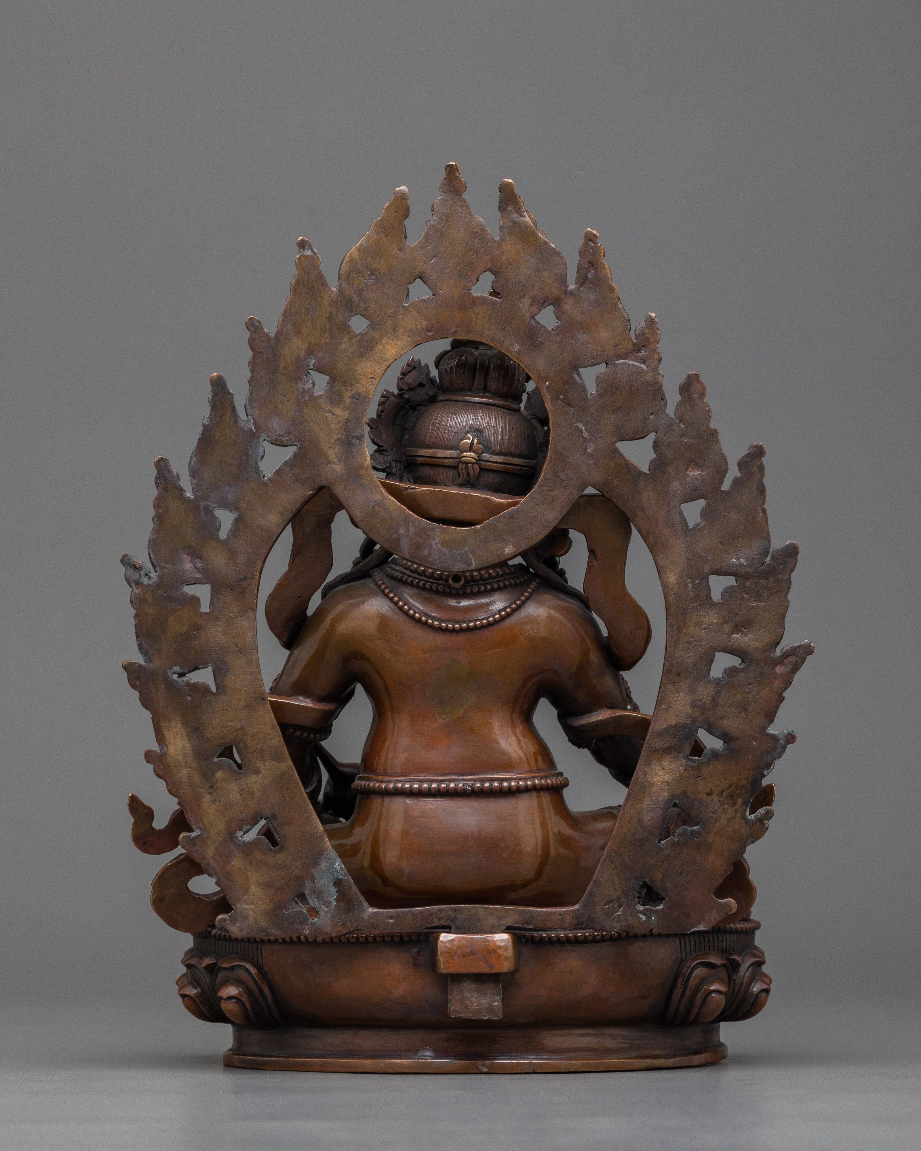 Yellow Zambhala Statue | An Oxidized Copper Emblem of Prosperity