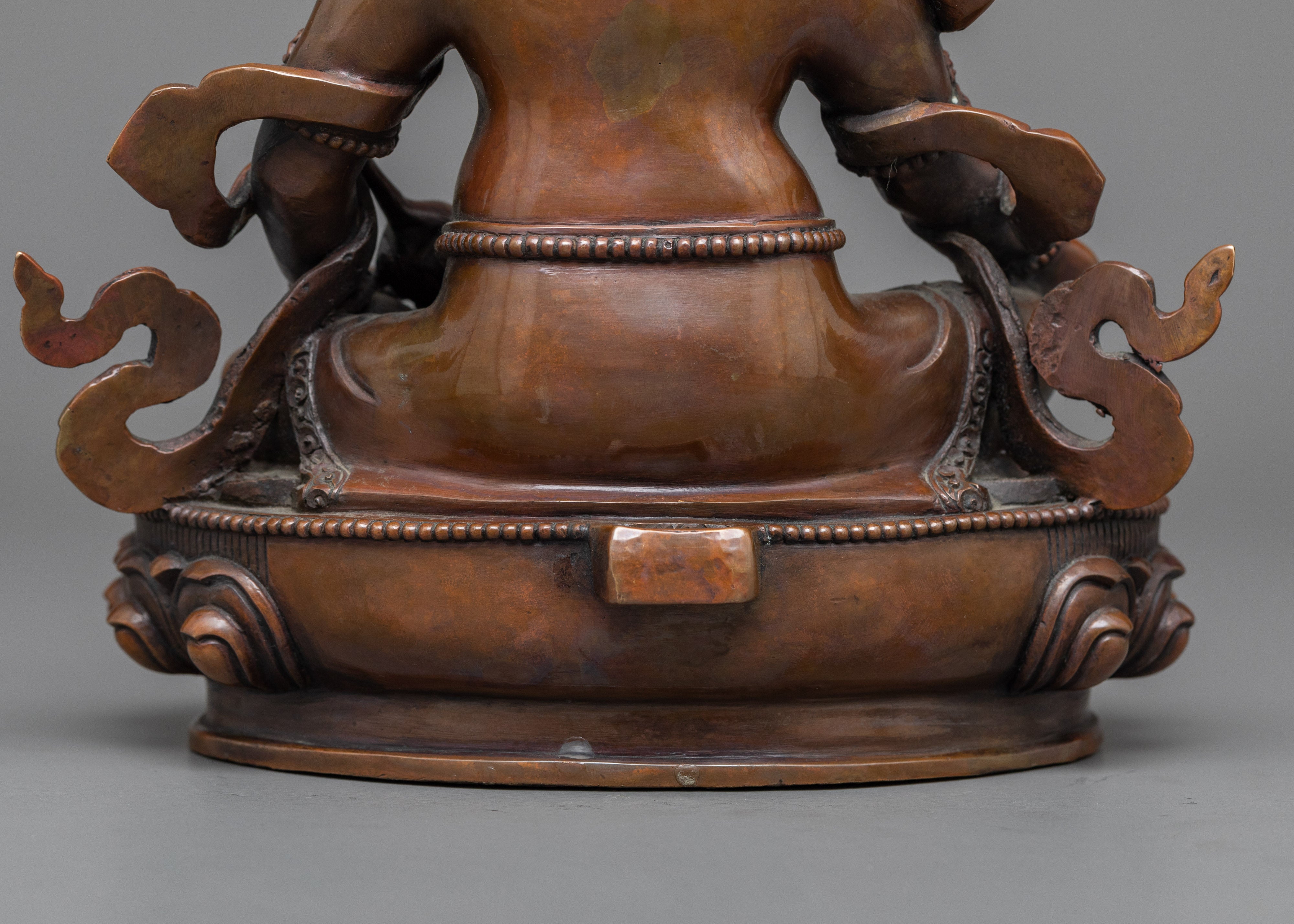 Yellow Zambhala Statue | An Oxidized Copper Emblem of Prosperity