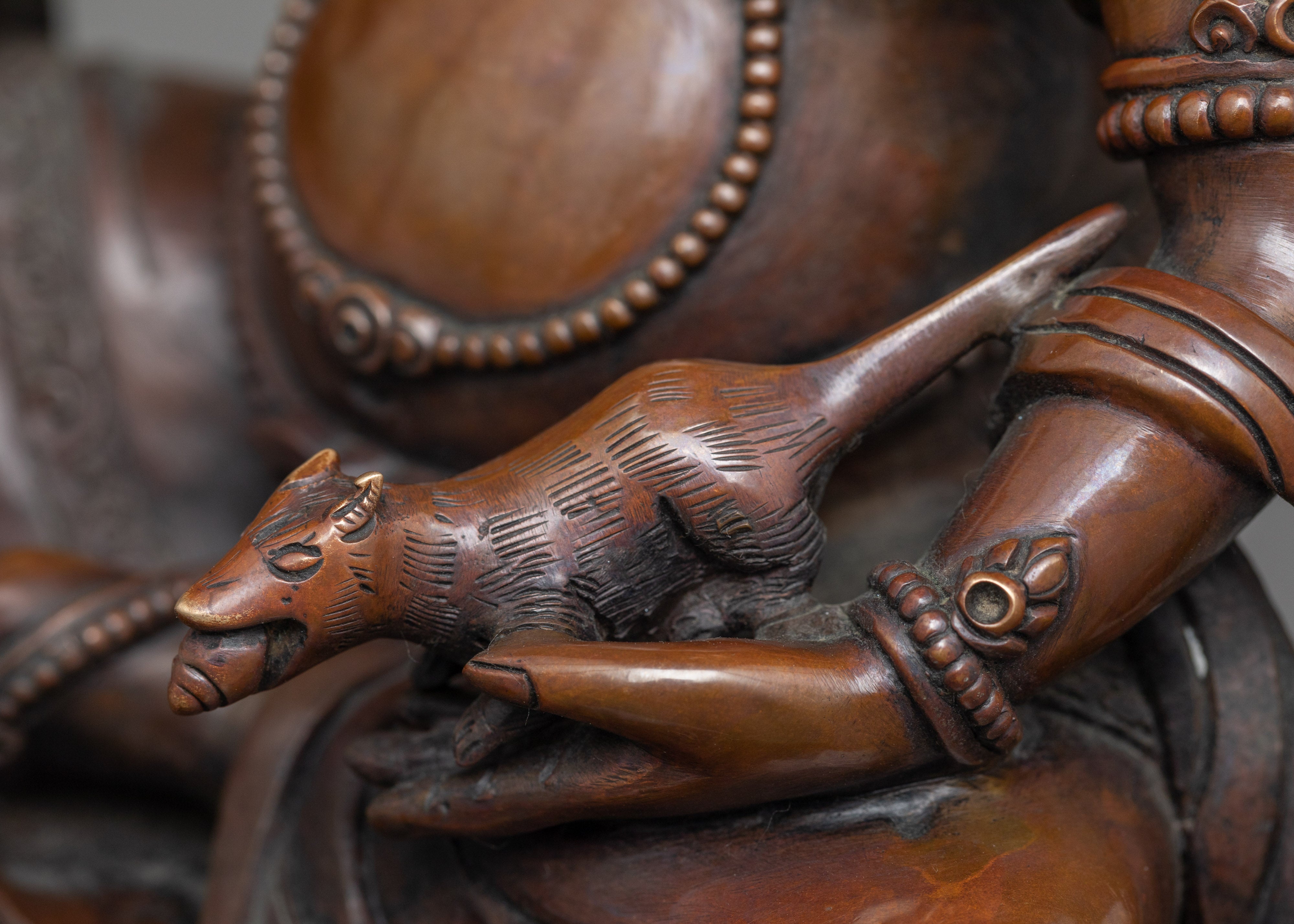 Yellow Zambhala Statue | An Oxidized Copper Emblem of Prosperity