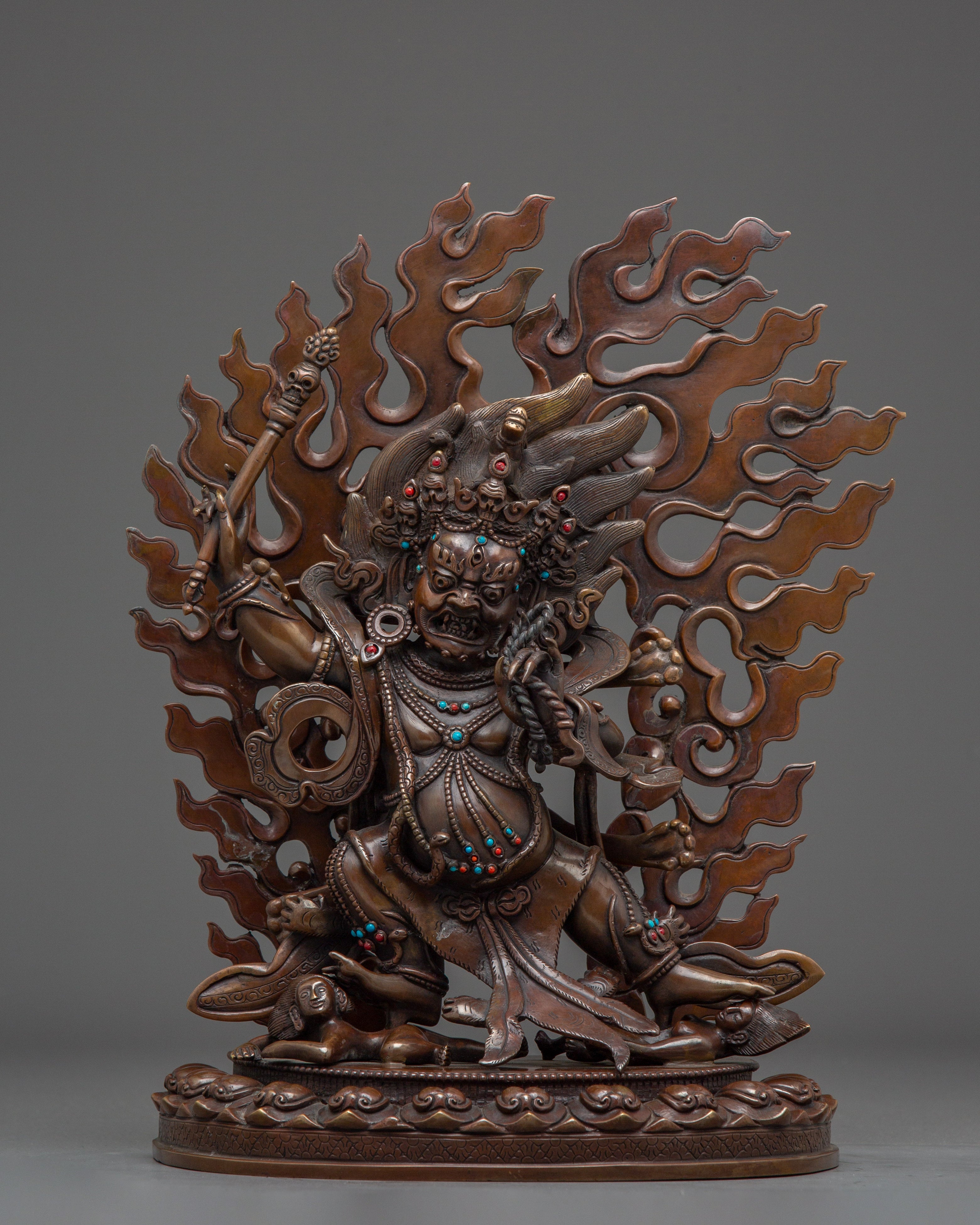 Dandapani statue in oxidized copper with gemstones