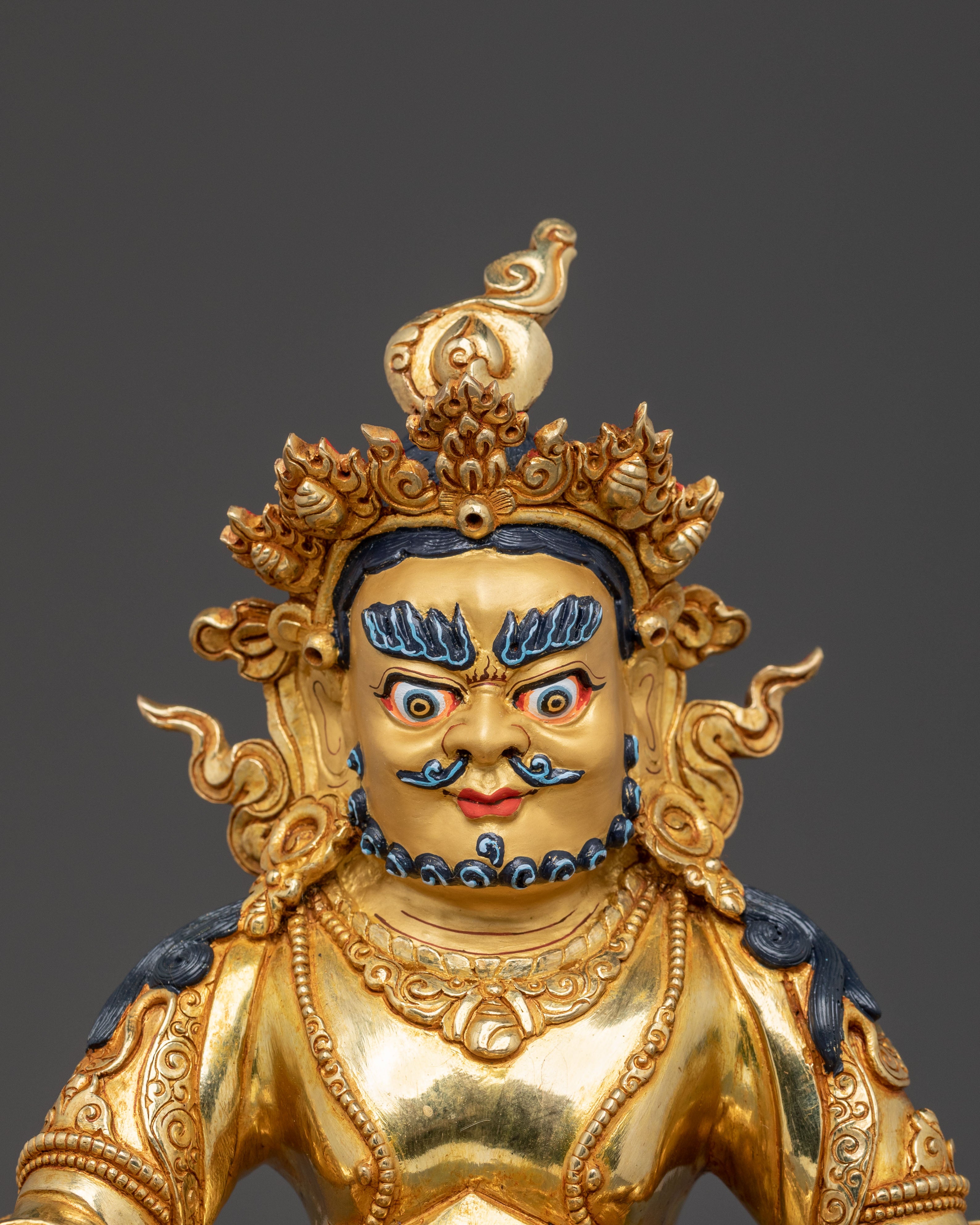 Golden Dzambhala Statue: Embodiment of Generosity