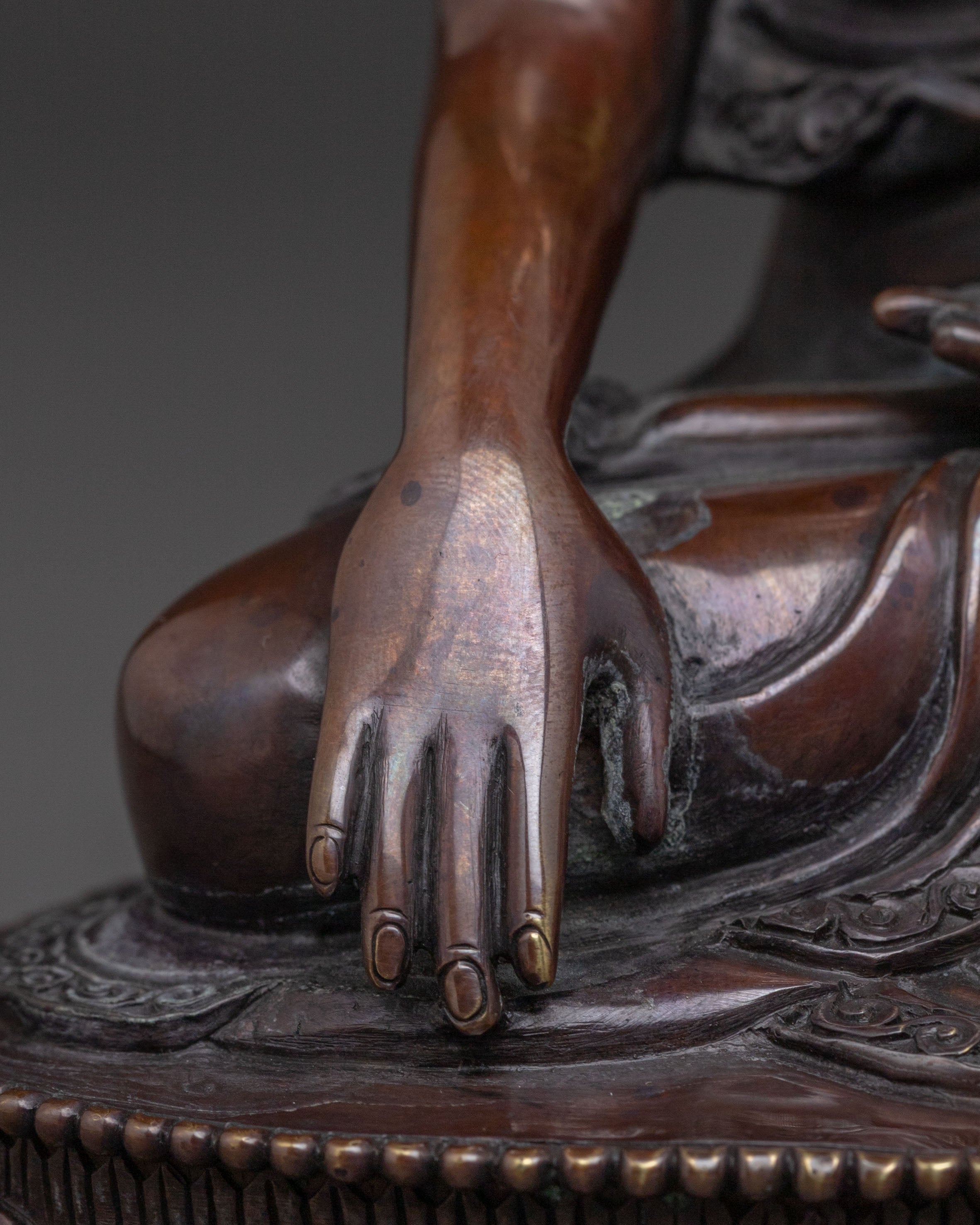 A Serene Oxidized Copper Statue of the Historical Shakyamuni Buddha
