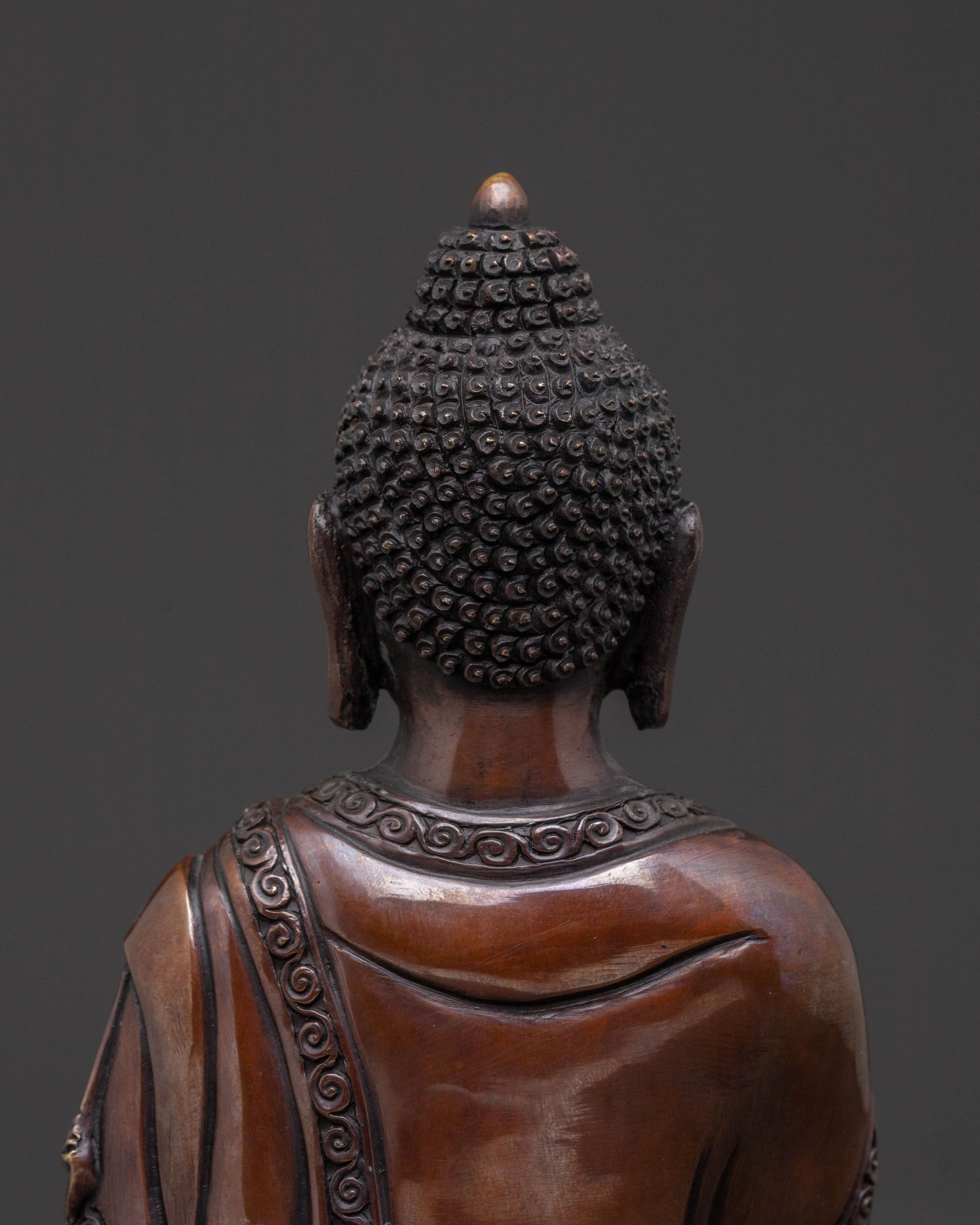 A Serene Oxidized Copper Statue of the Historical Shakyamuni Buddha