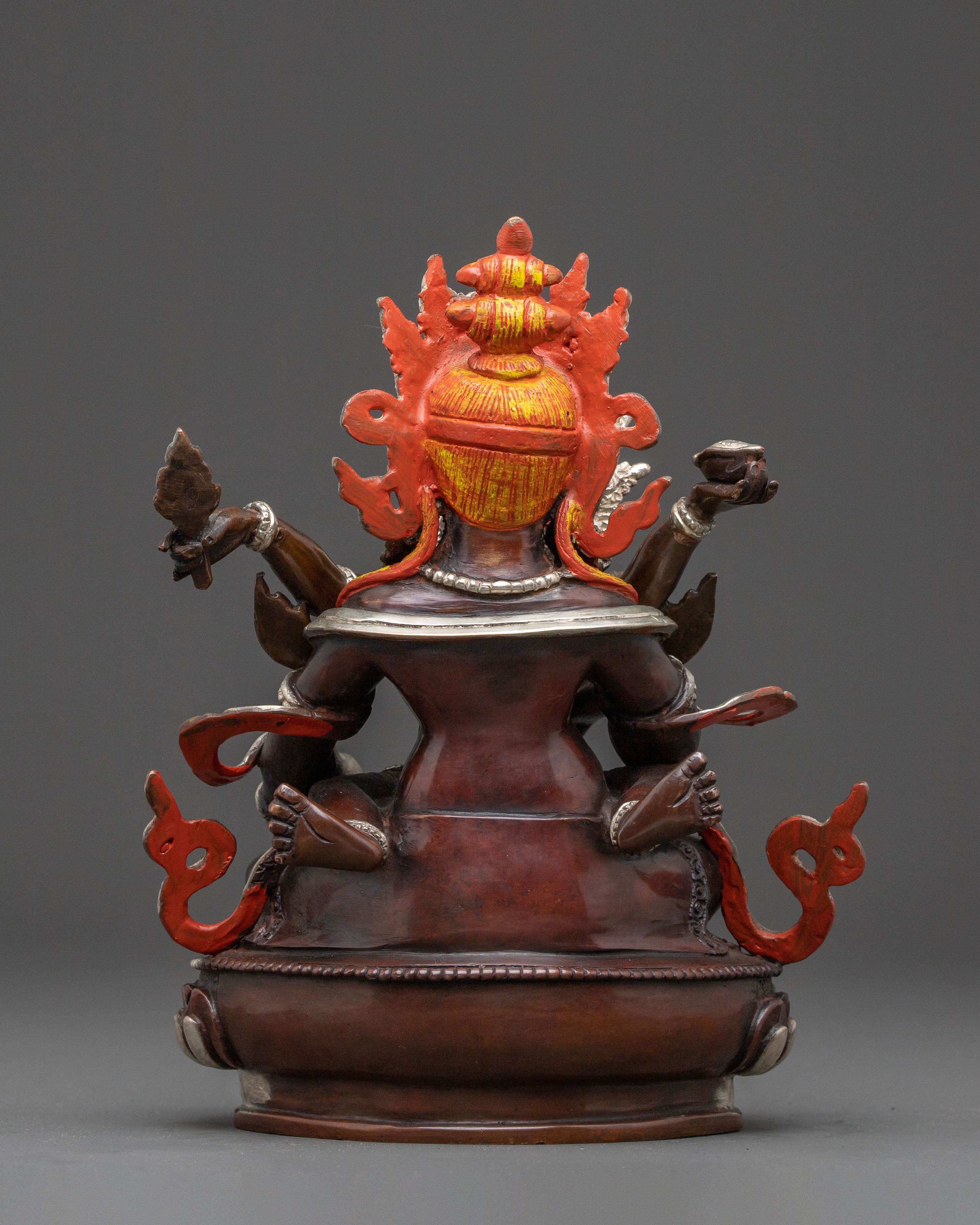 Handcrafted Statue of Red Dzambhala: Oxidized Copper Form