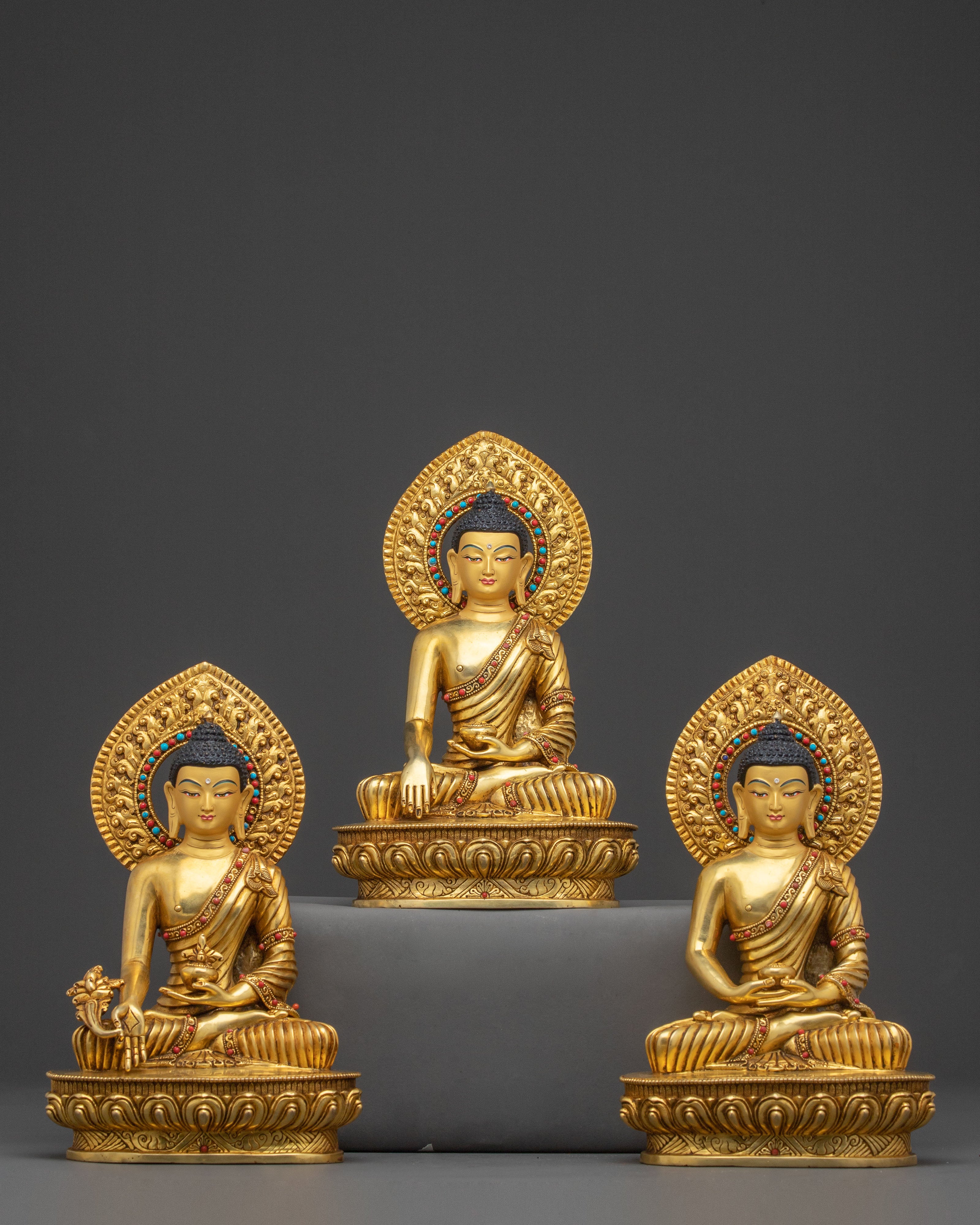 A 24K Gold Gilded Statue of Three Buddha Set