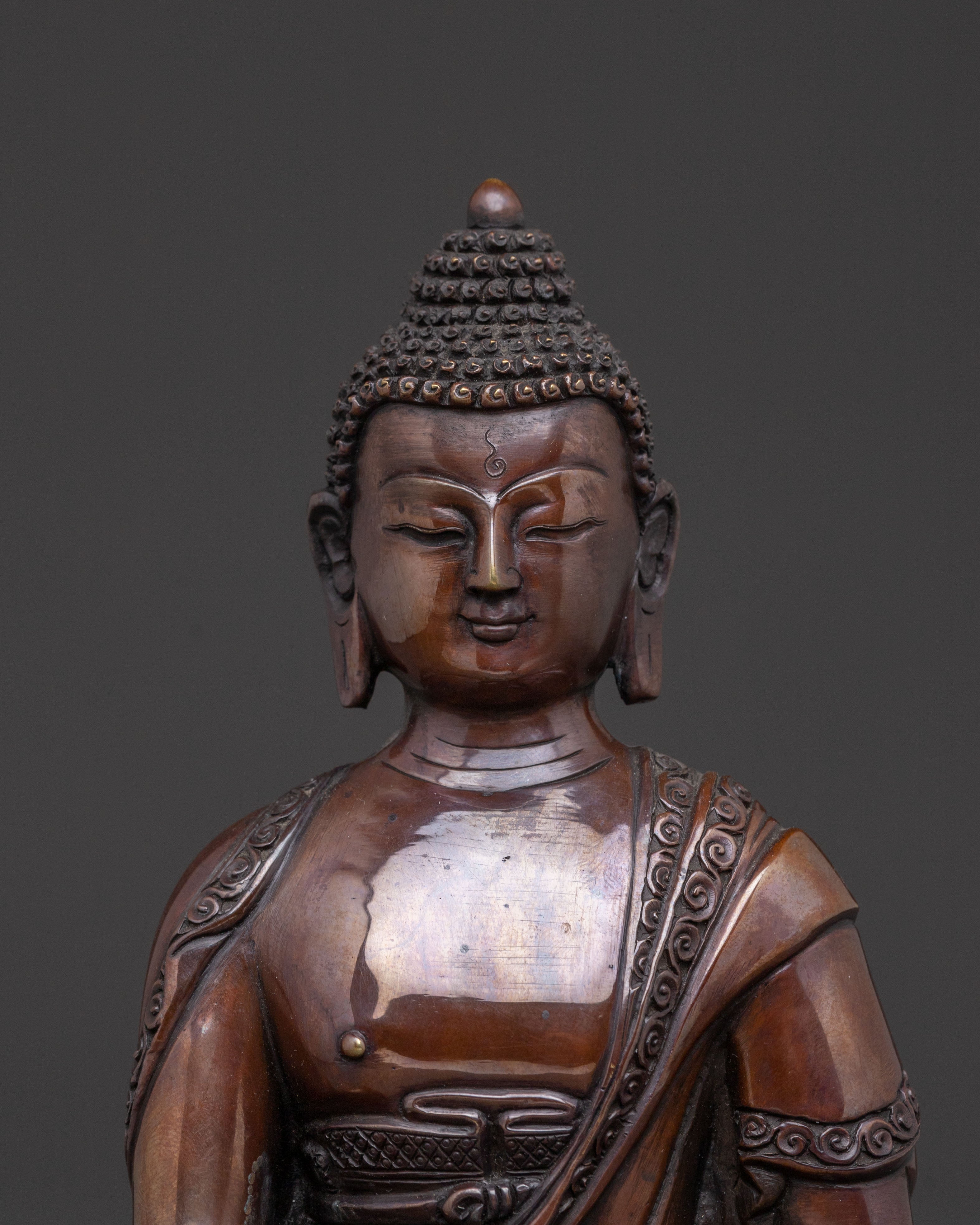 A Serene Oxidized Copper Statue of the Historical Shakyamuni Buddha