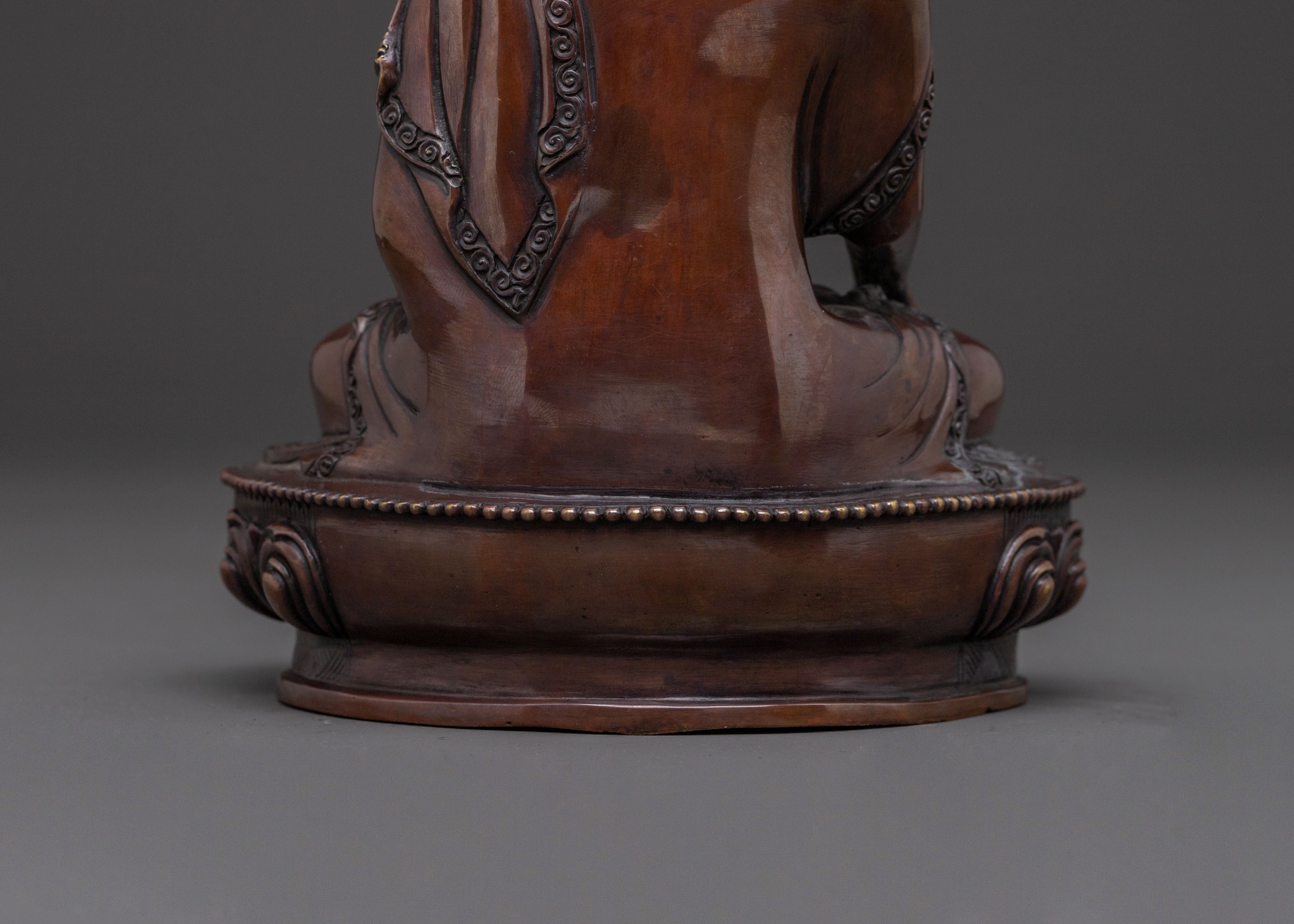 A Serene Oxidized Copper Statue of the Historical Shakyamuni Buddha