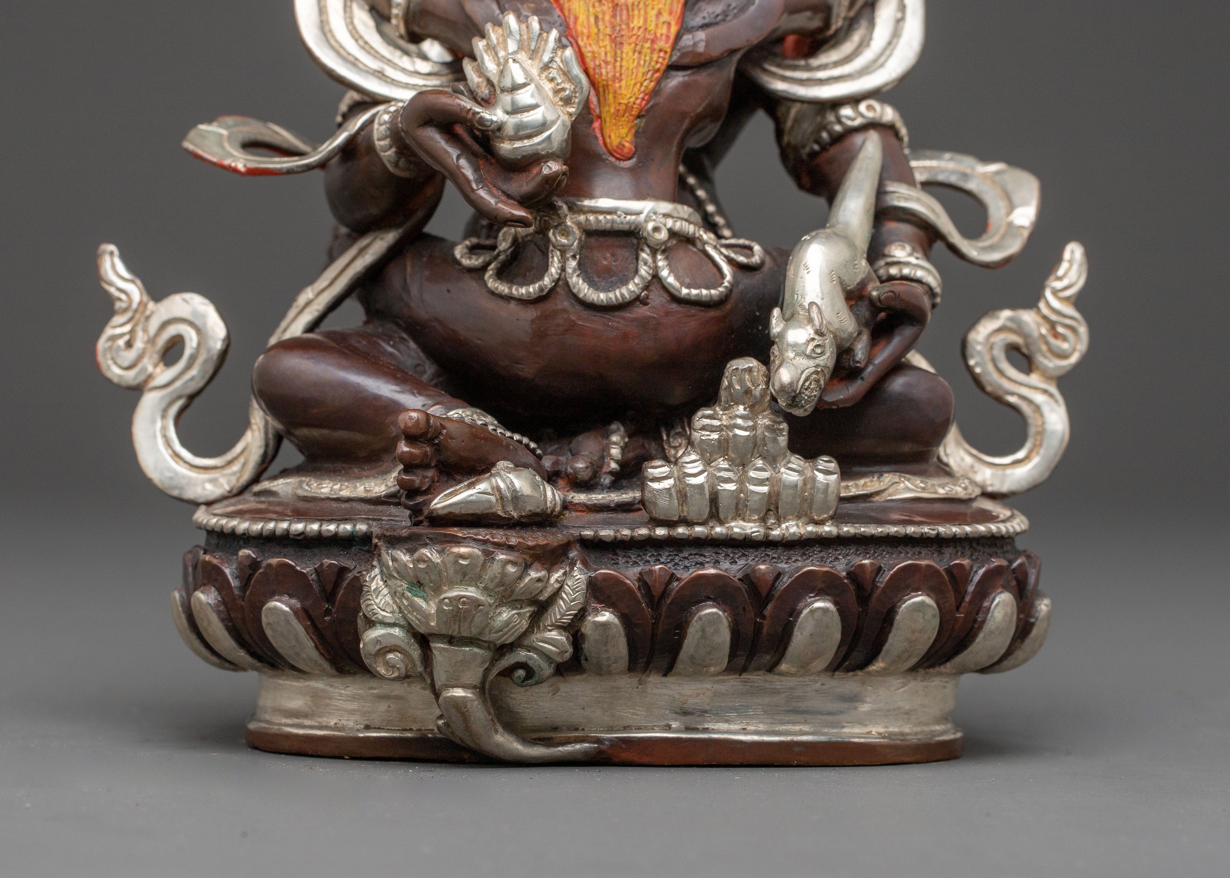 Handcrafted Statue of Red Dzambhala: Oxidized Copper Form