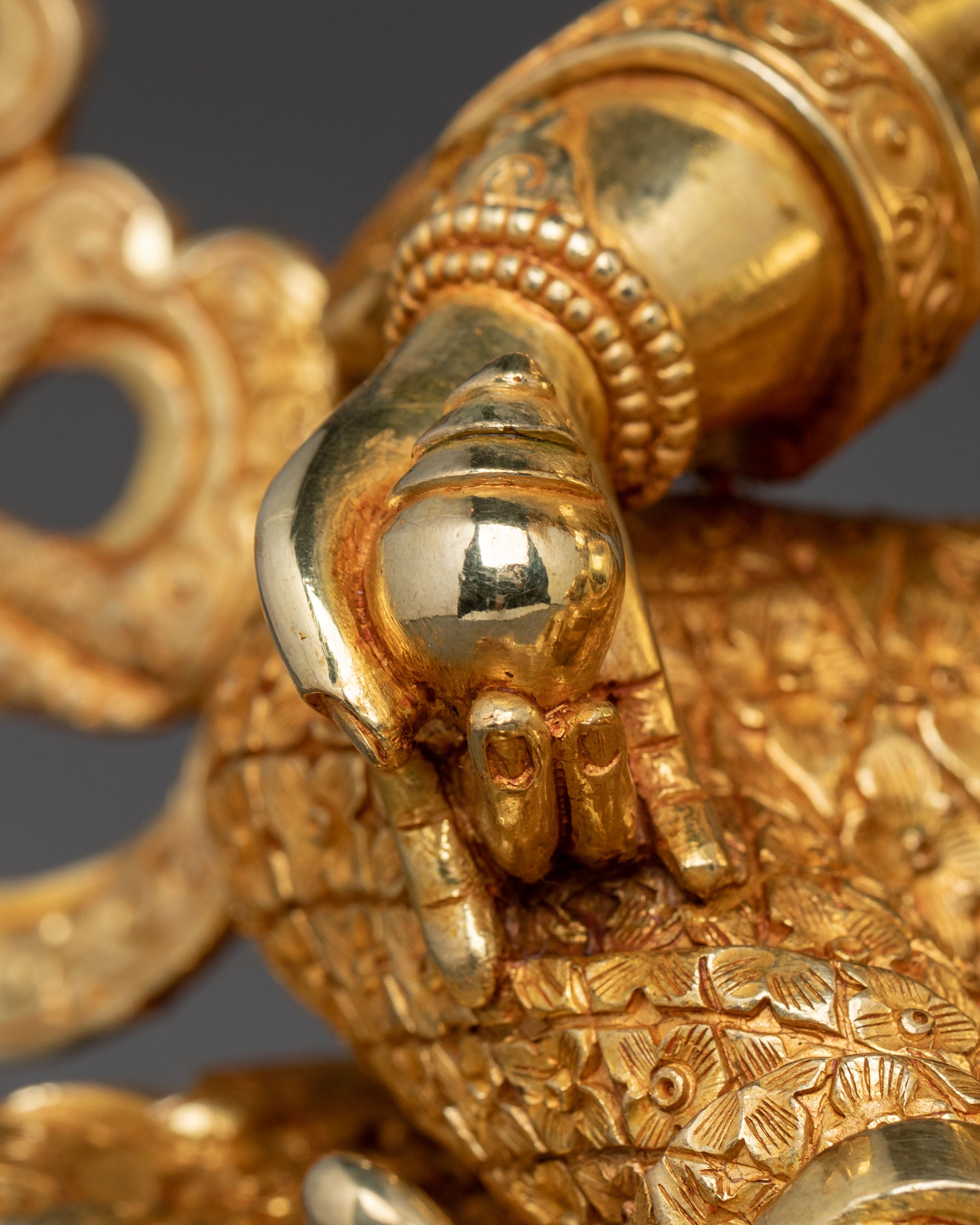 Golden Dzambhala Statue: Embodiment of Generosity