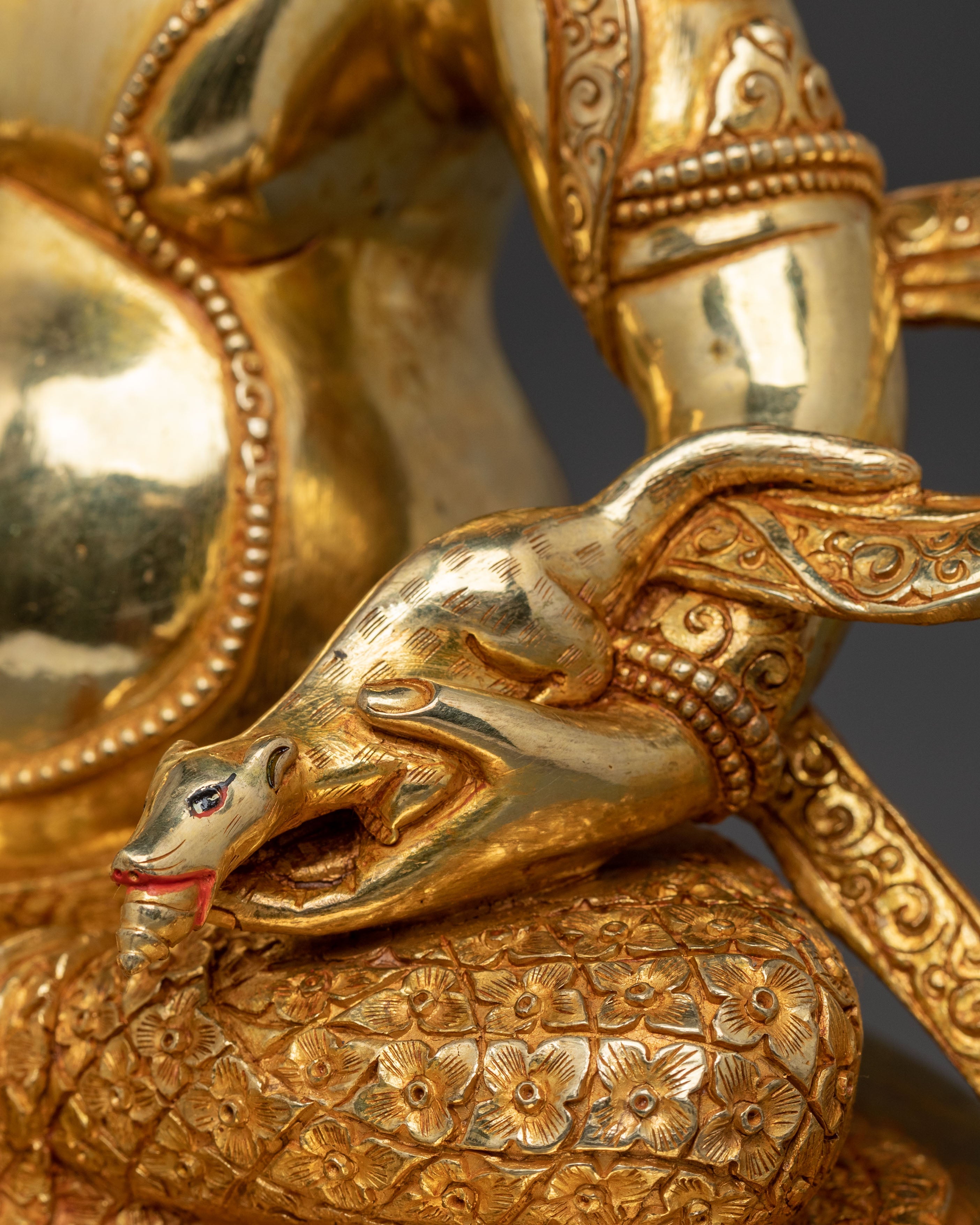 Golden Dzambhala Statue: Embodiment of Generosity