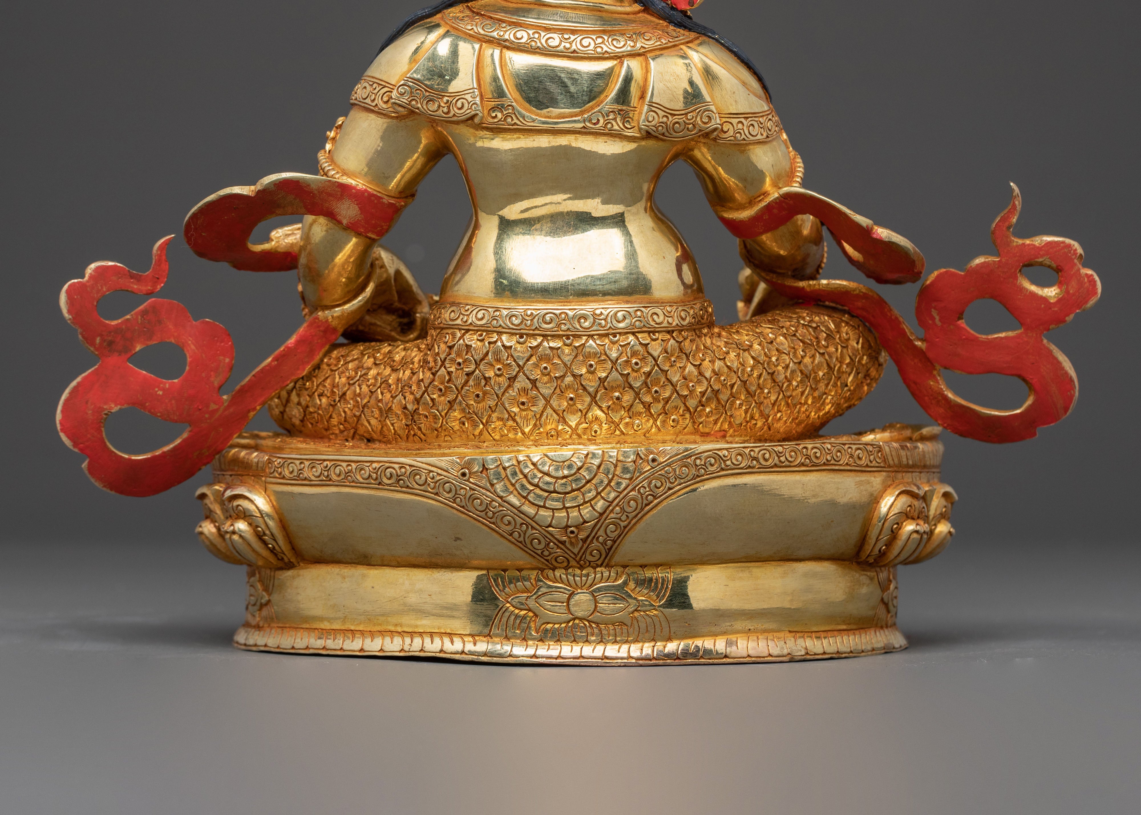 Golden Dzambhala Statue: Embodiment of Generosity