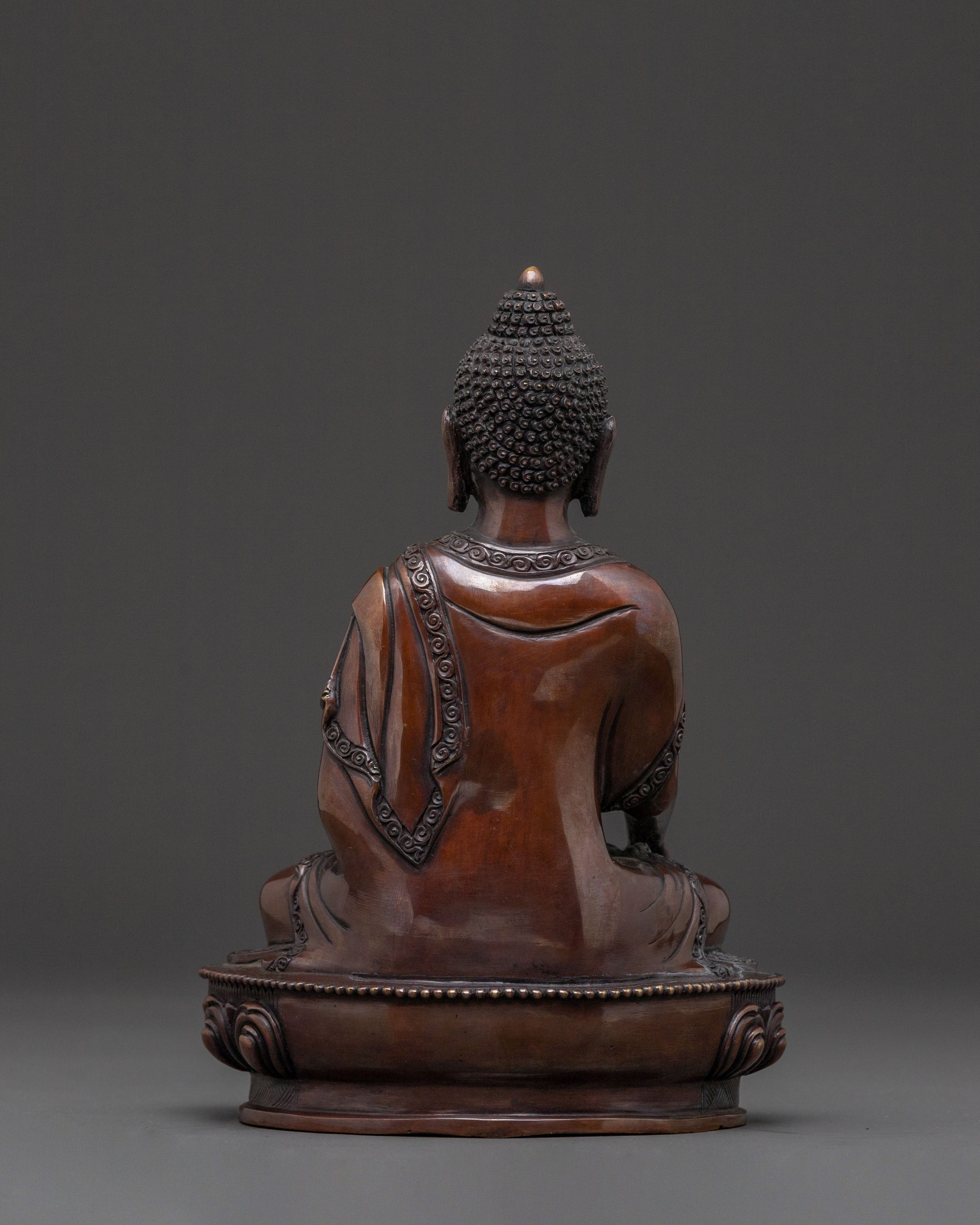 A Serene Oxidized Copper Statue of the Historical Shakyamuni Buddha