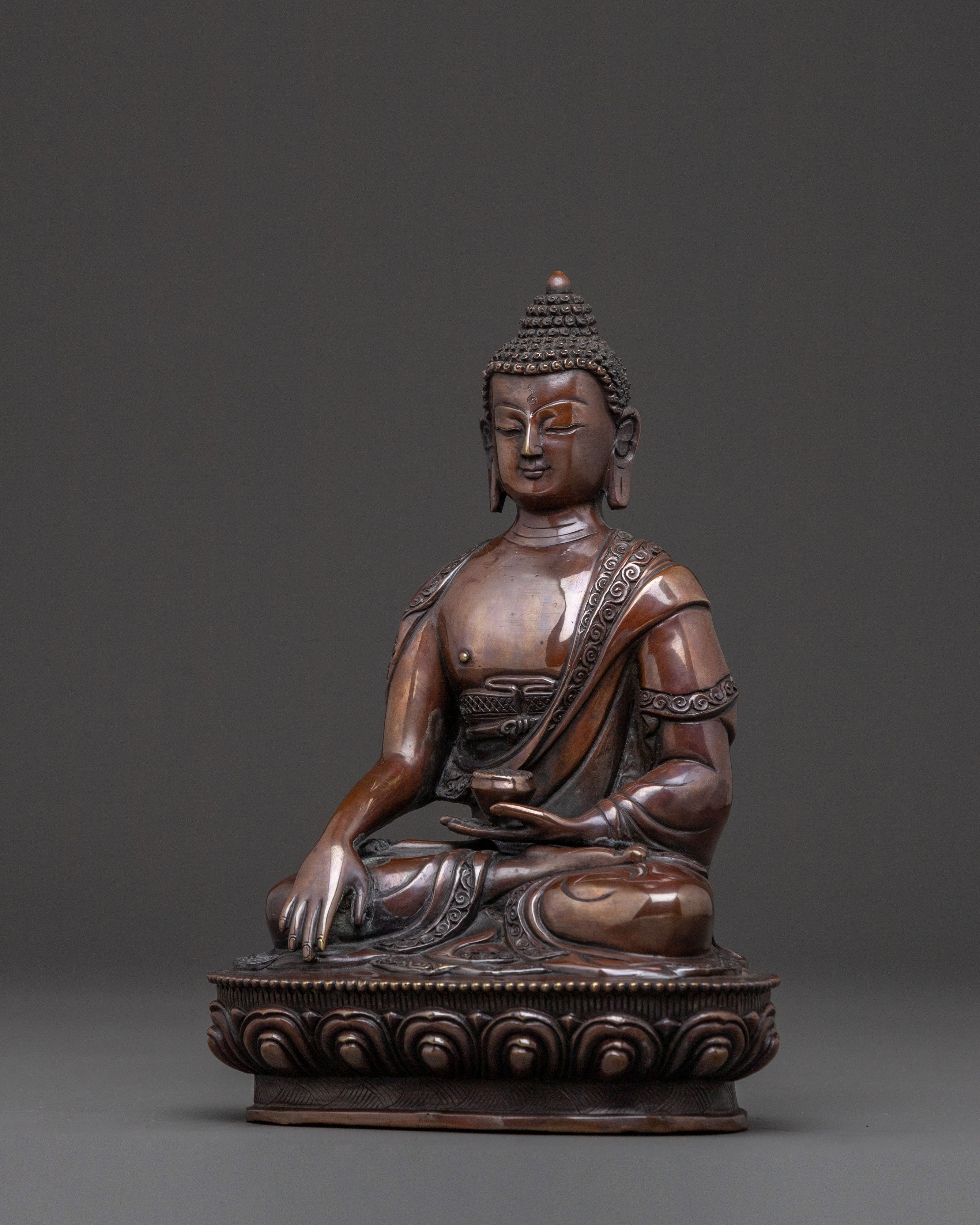 A Serene Oxidized Copper Statue of the Historical Shakyamuni Buddha