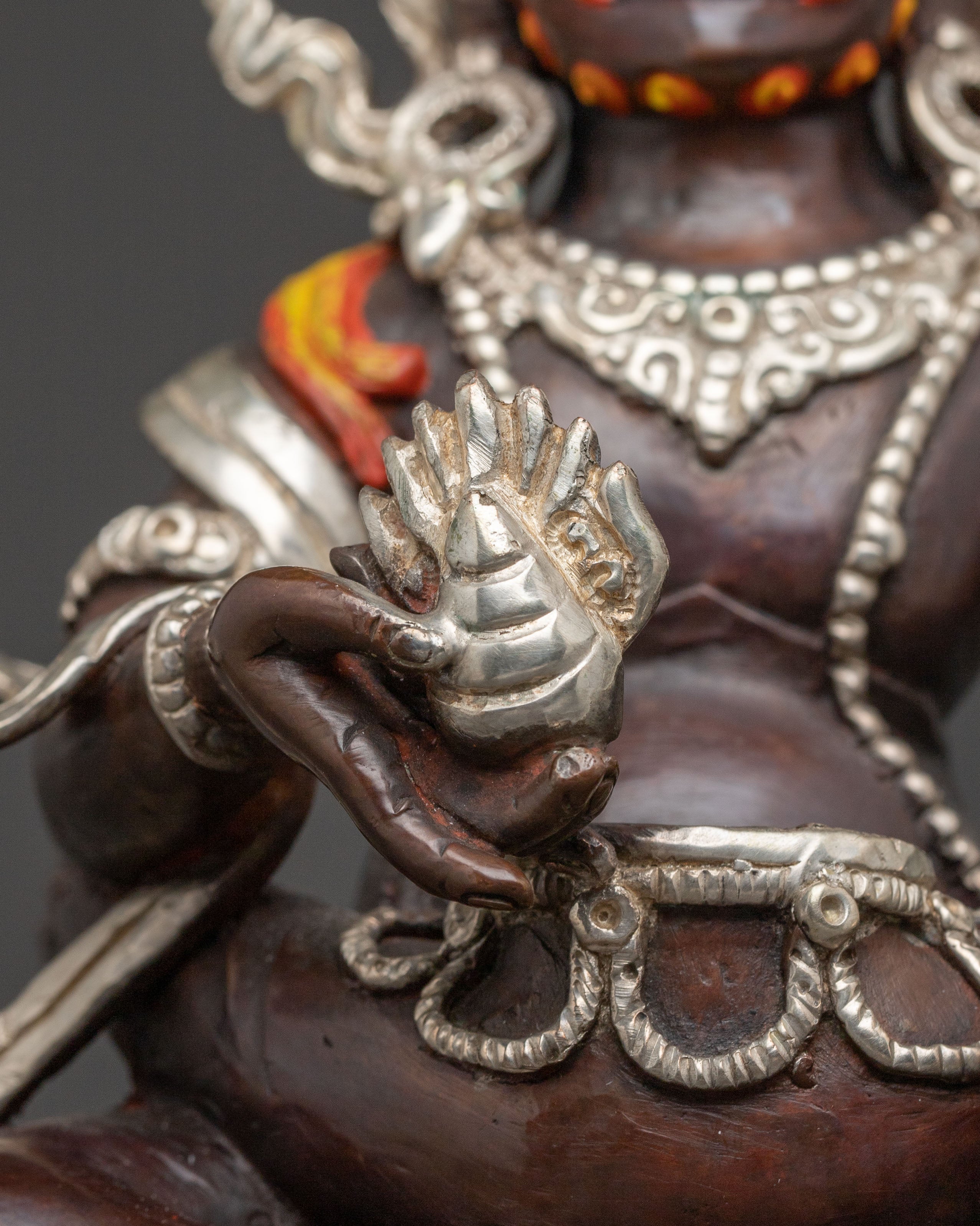 Handcrafted Statue of Red Dzambhala: Oxidized Copper Form