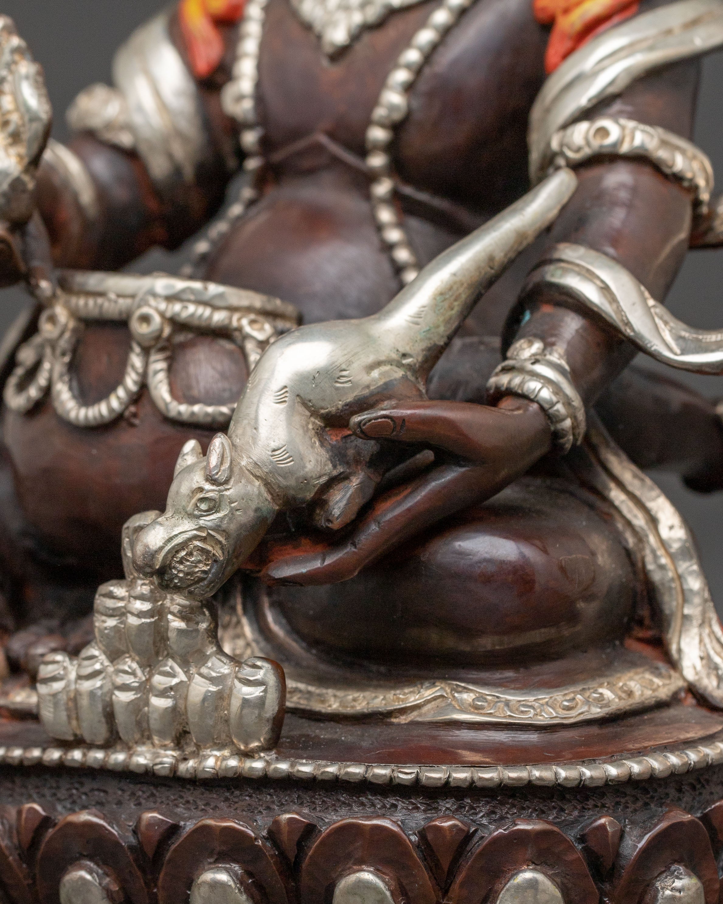 Handcrafted Statue of Red Dzambhala: Oxidized Copper Form