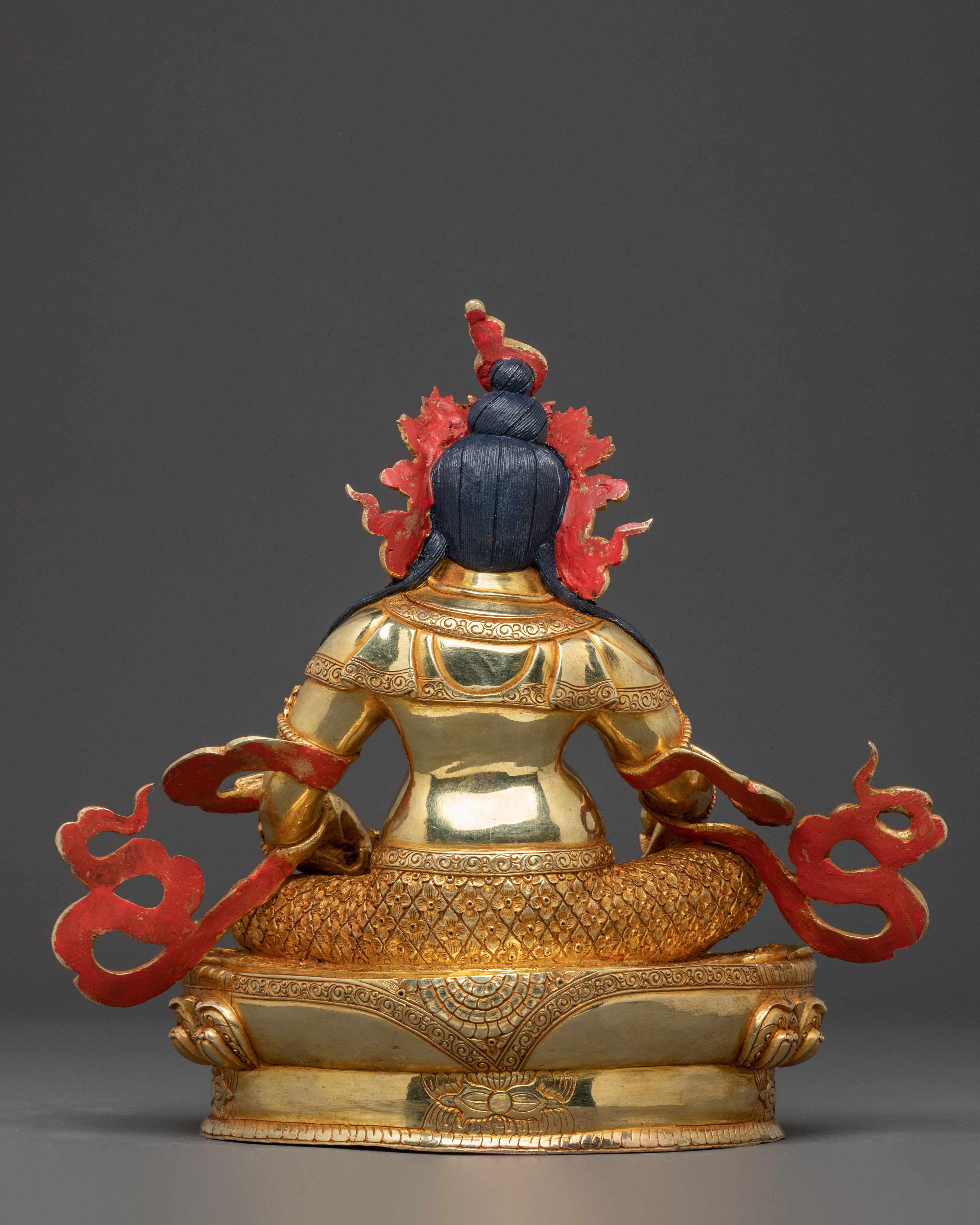 Golden Dzambhala Statue: Embodiment of Generosity