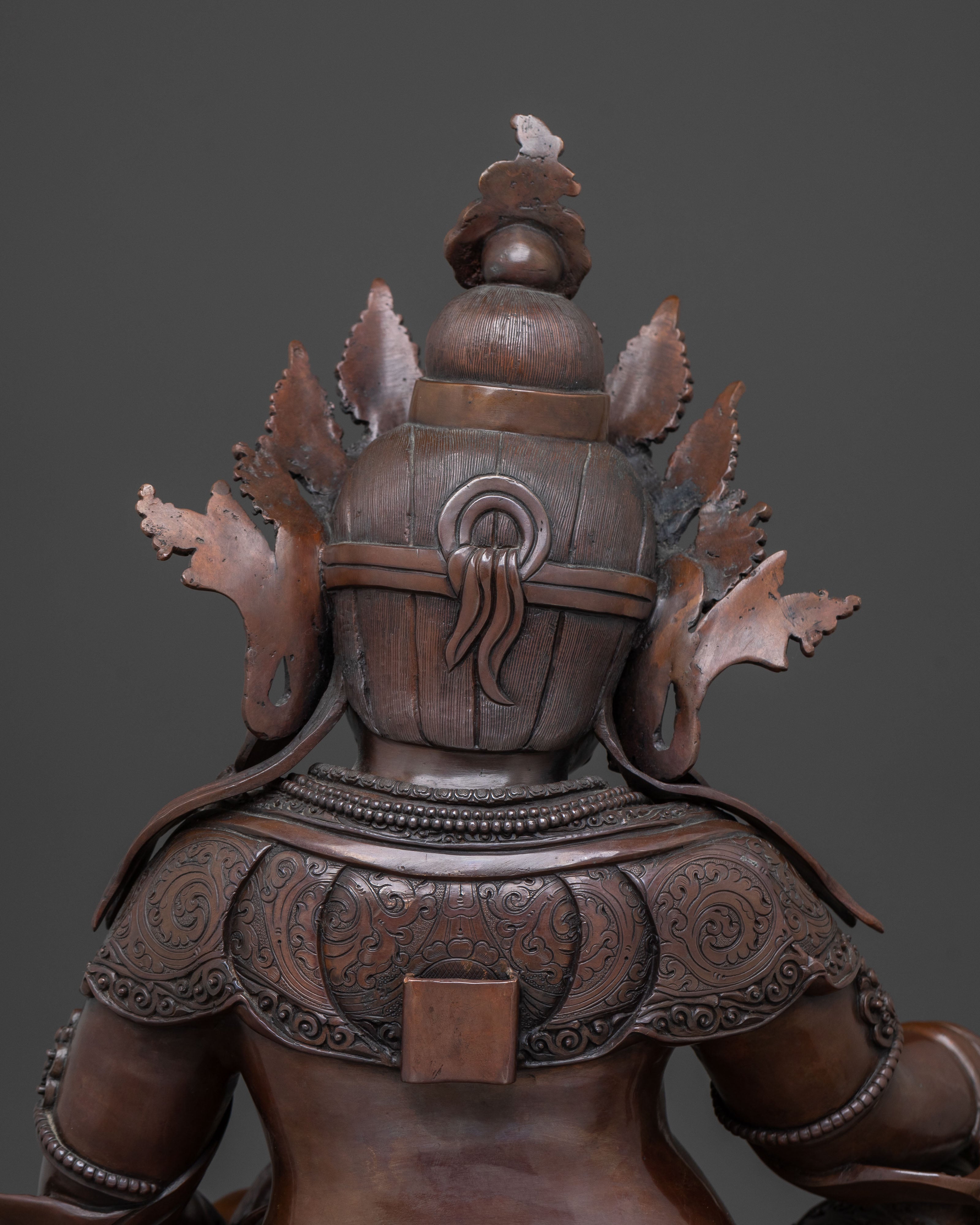 Deity of Wealth: Dzambhala Oxidized Copper Statue