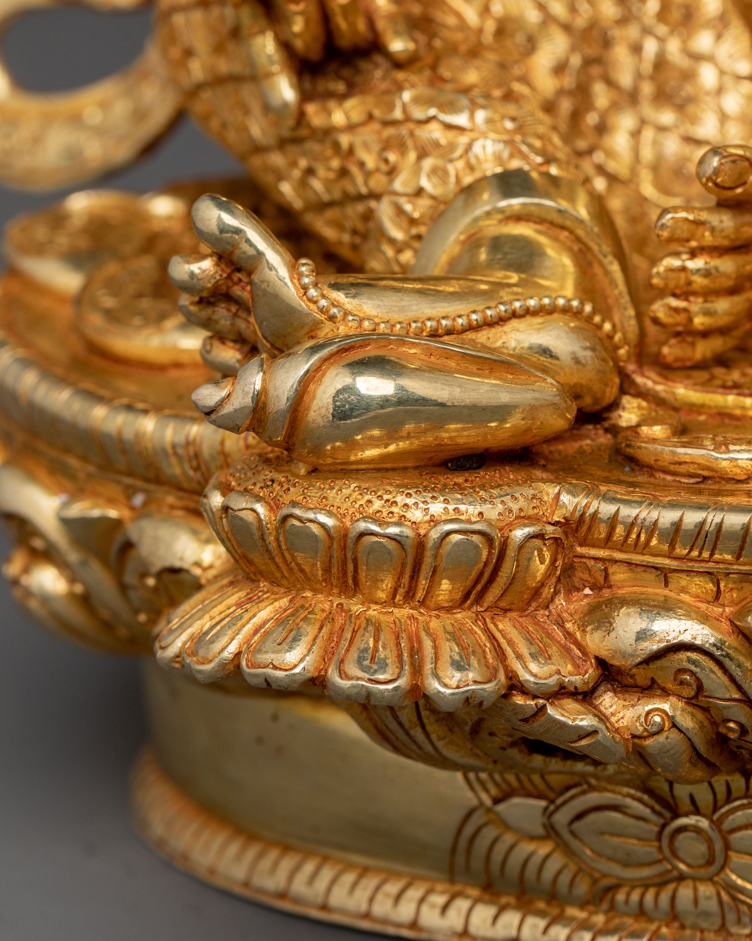 Golden Dzambhala Statue: Embodiment of Generosity