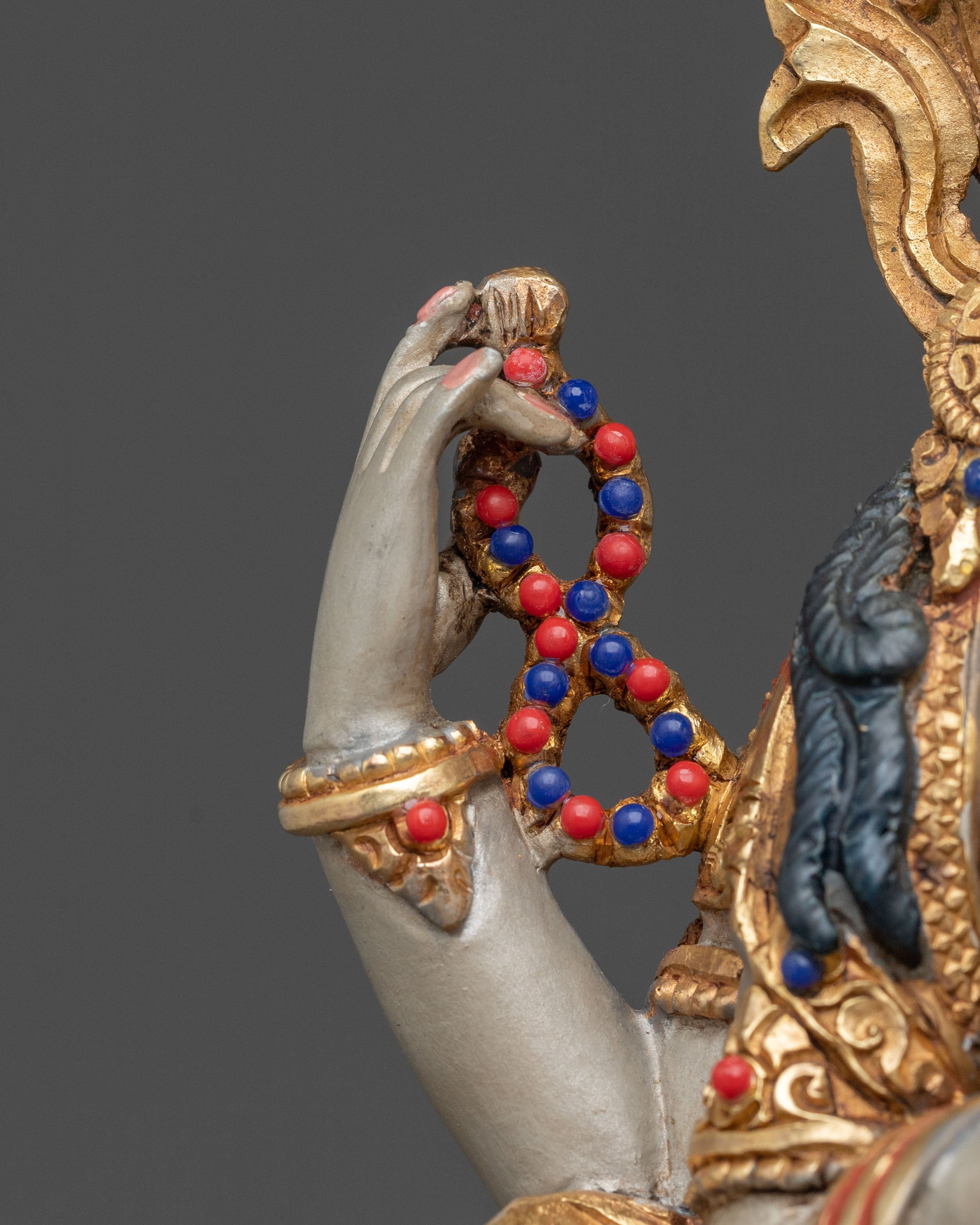 Hand Carved Four Armed Chenrezig Sculpture: Embodiment of Compassion