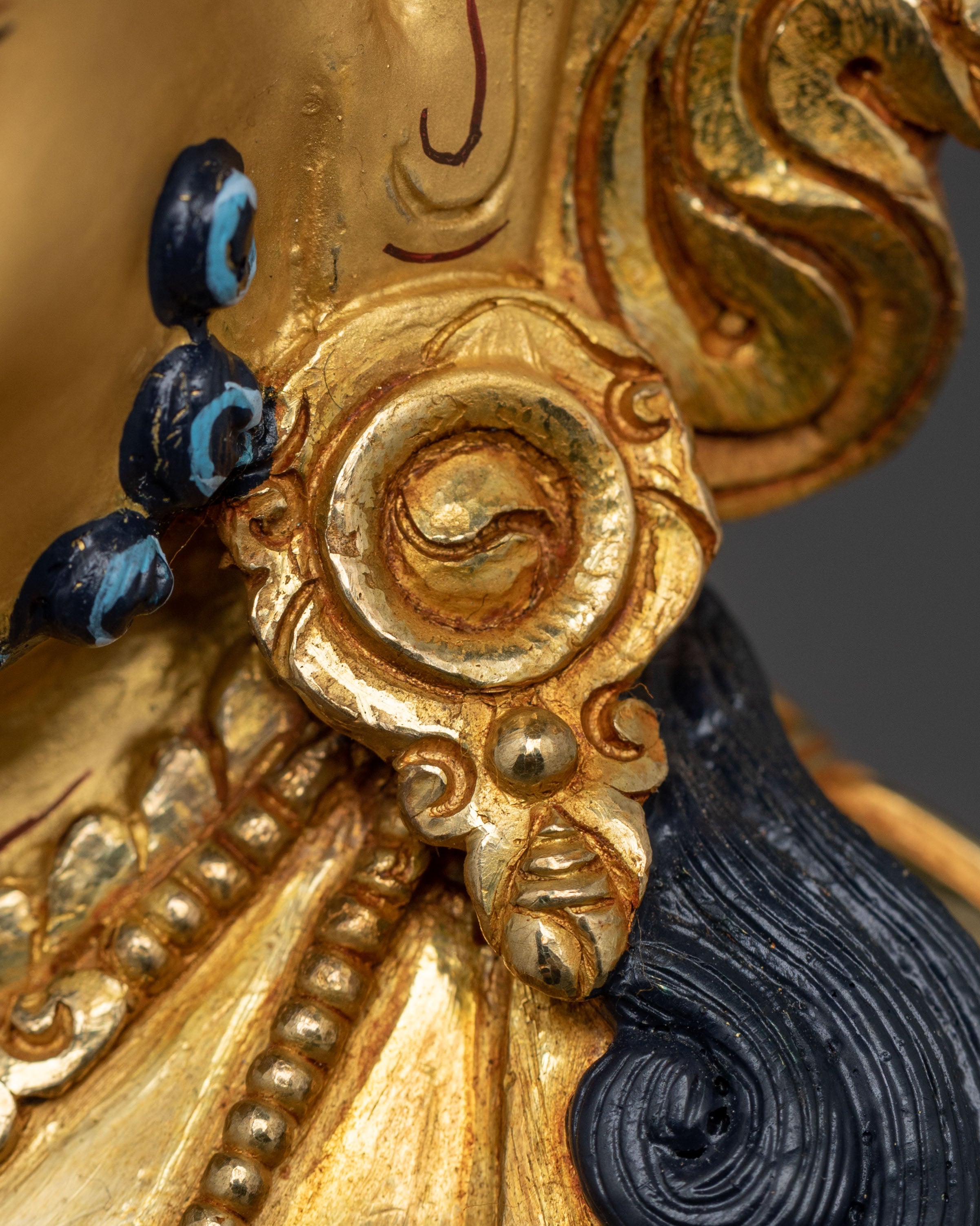 Golden Dzambhala Statue: Embodiment of Generosity