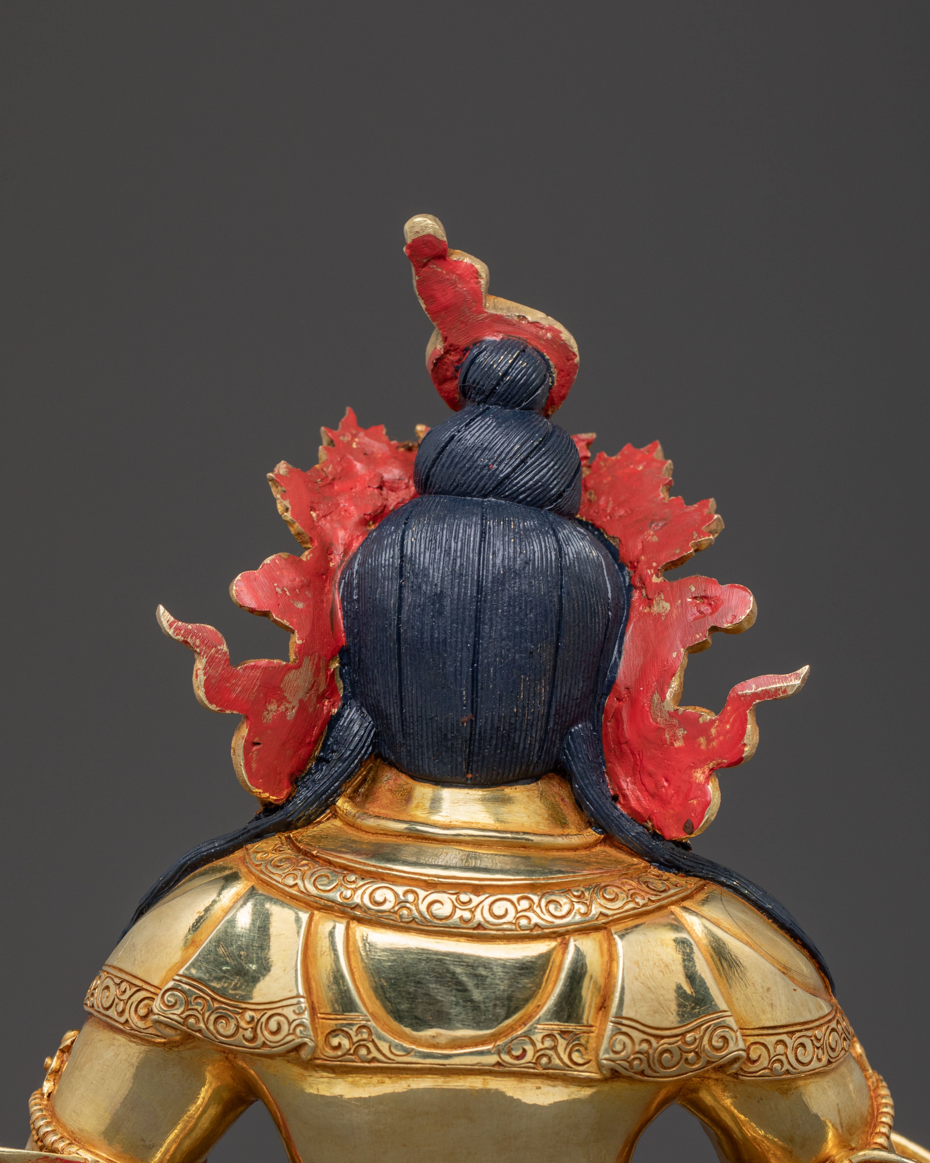 Golden Dzambhala Statue: Embodiment of Generosity