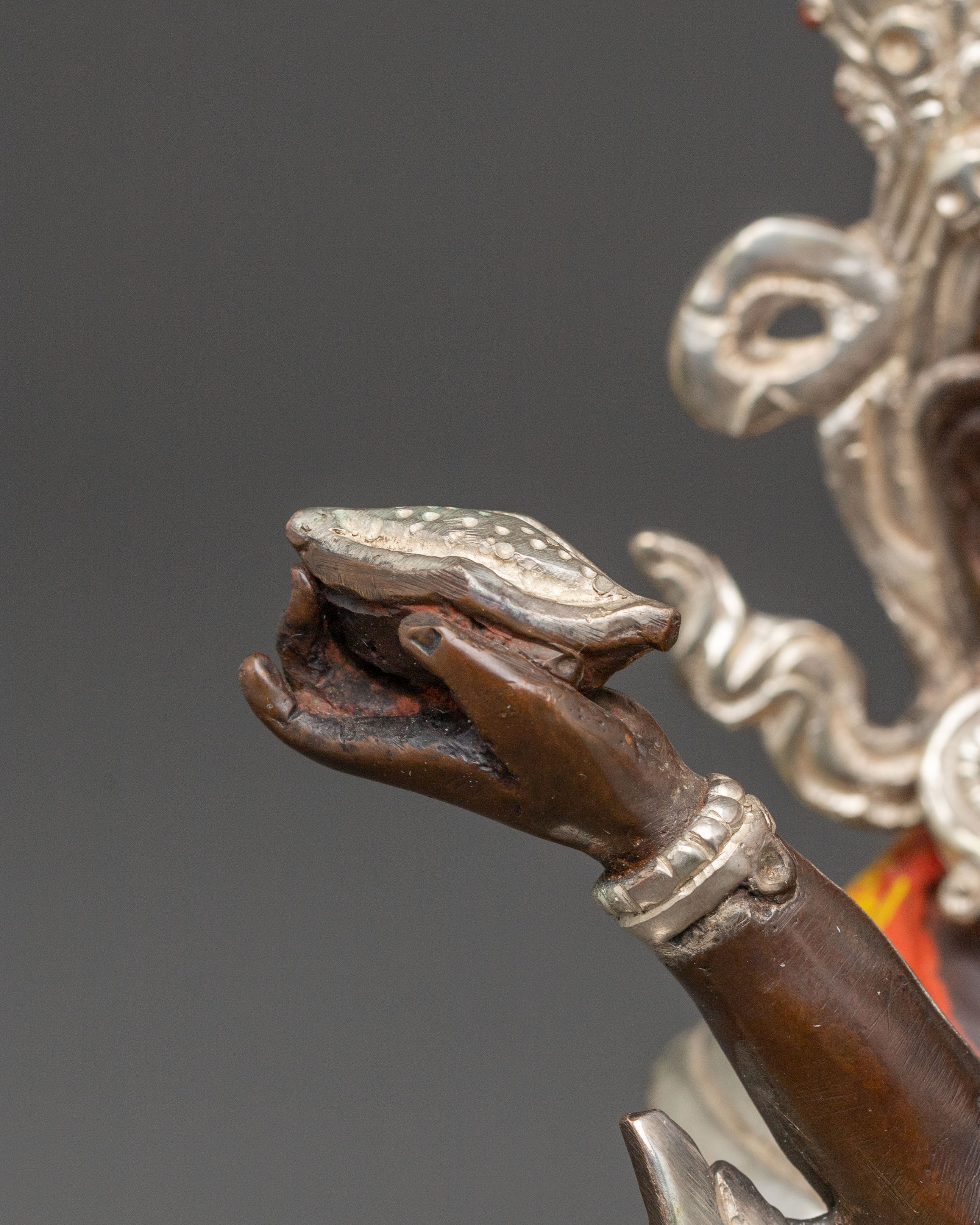 Handcrafted Statue of Red Dzambhala: Oxidized Copper Form