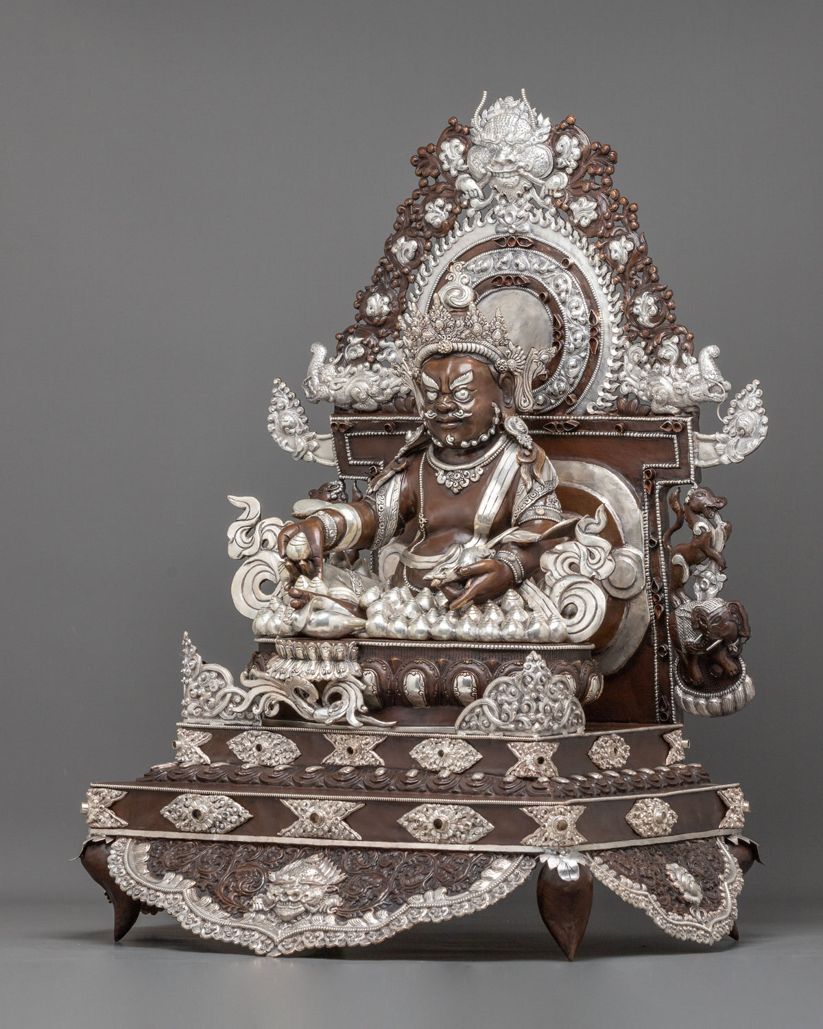 Dzambhala Statue on Throne | Oxidized Copper Figurine with Silver Plating